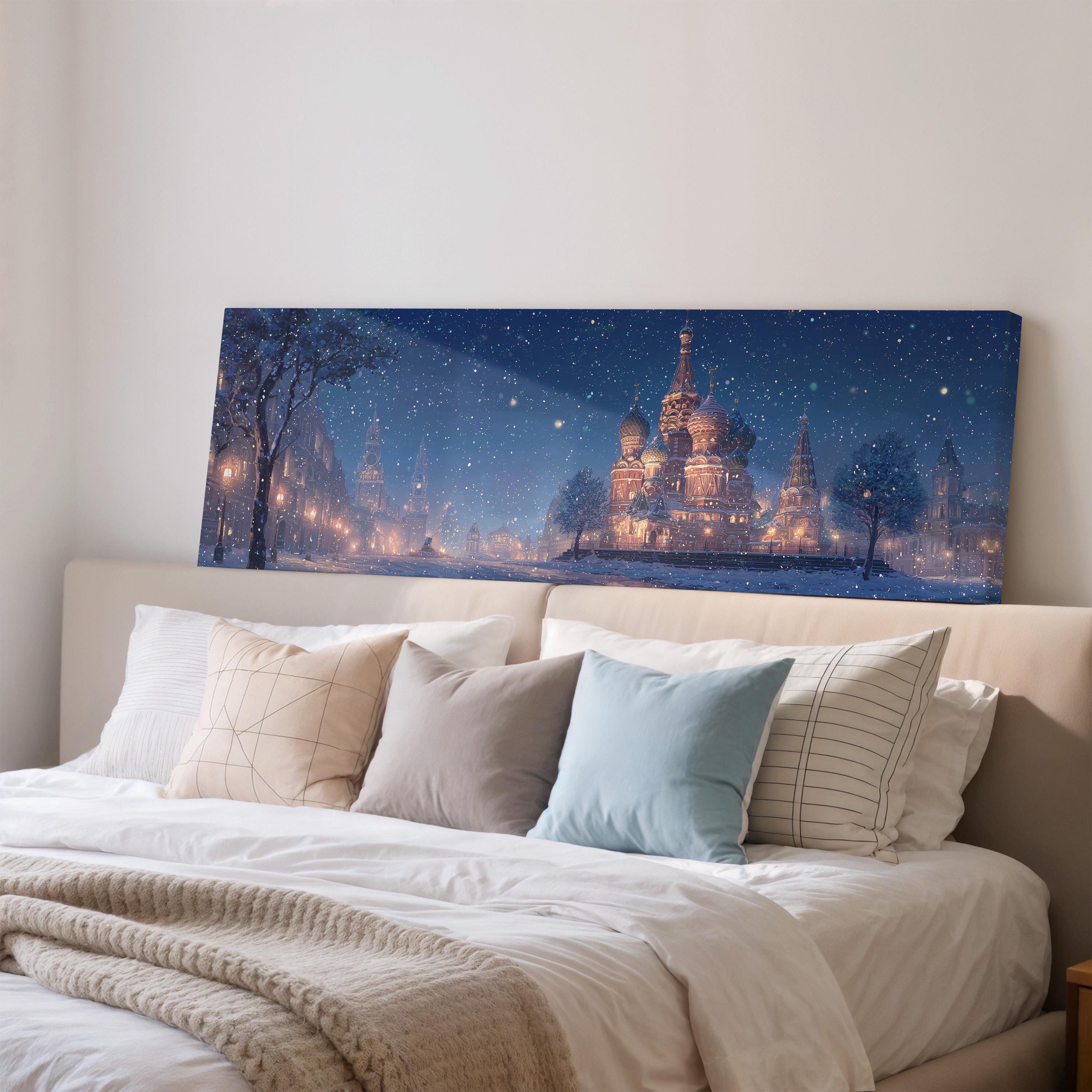 a large, framed painting of a cityscape with a castle in the background, hanging on a wall above a bed with white pillows and a gray blanket.