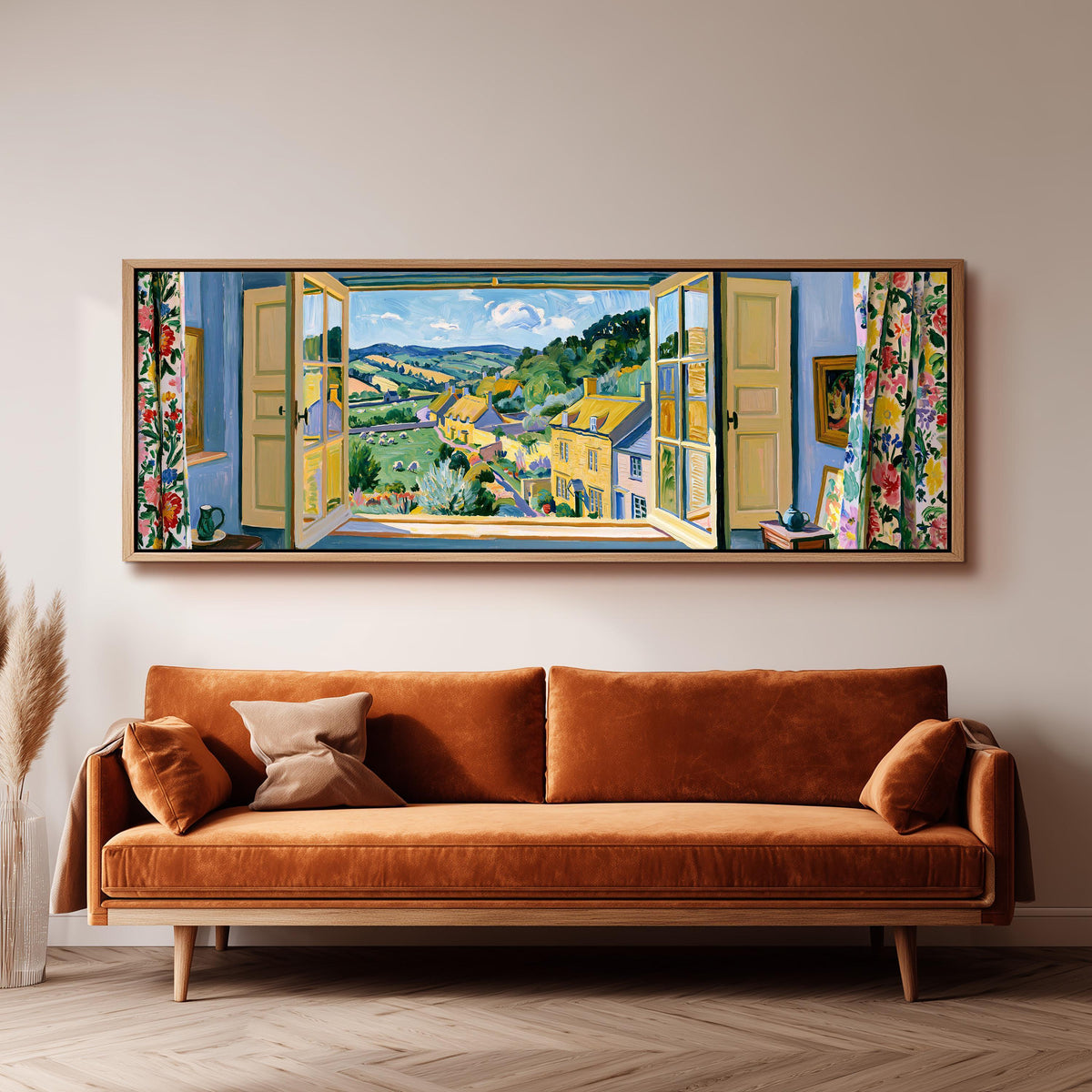 English countryside village through a window panoramic canvas print above a sofa in a living room