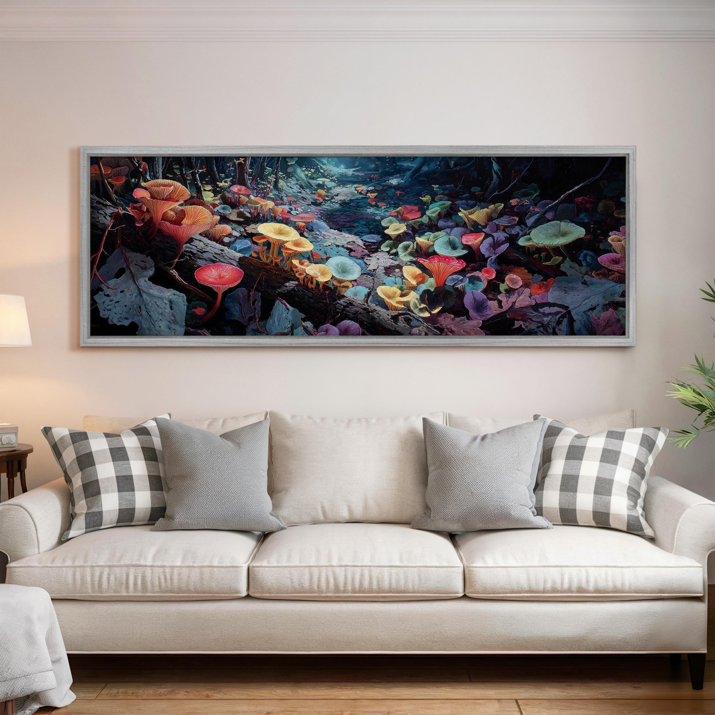 a large, colorful painting of mushrooms hanging on a wall above a white couch with gray and white pillows.