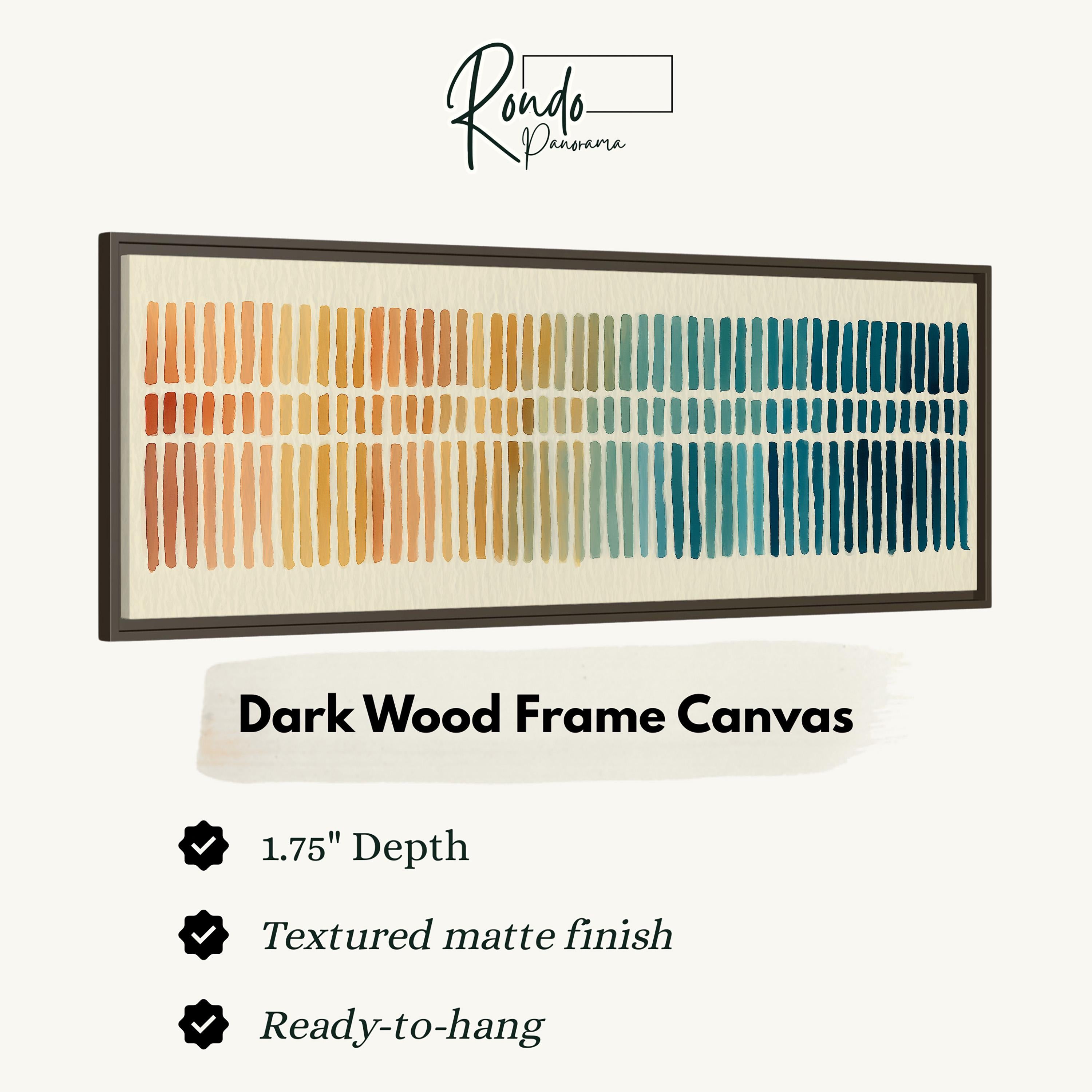 a dark wood frame canvas with a gradient of colors, including orange, yellow, green, blue, and purple. The frame has a 1.75" depth and is textured with a matte finish. It is ready to hang.