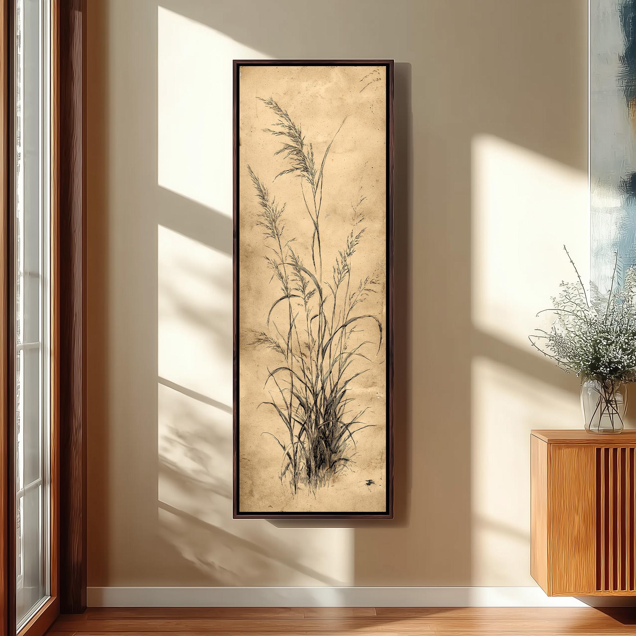 a large framed artwork of tall grasses hanging on a wall in a room with a wooden floor and a window.