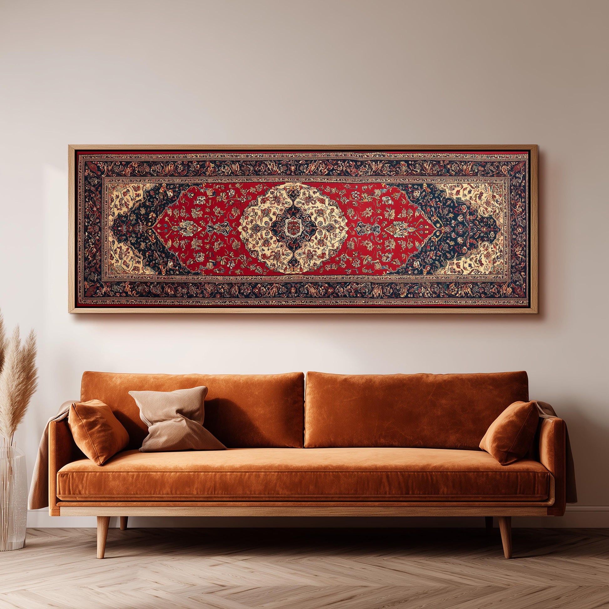 a large, ornate rug hanging on a wall above a brown sofa with two pillows.