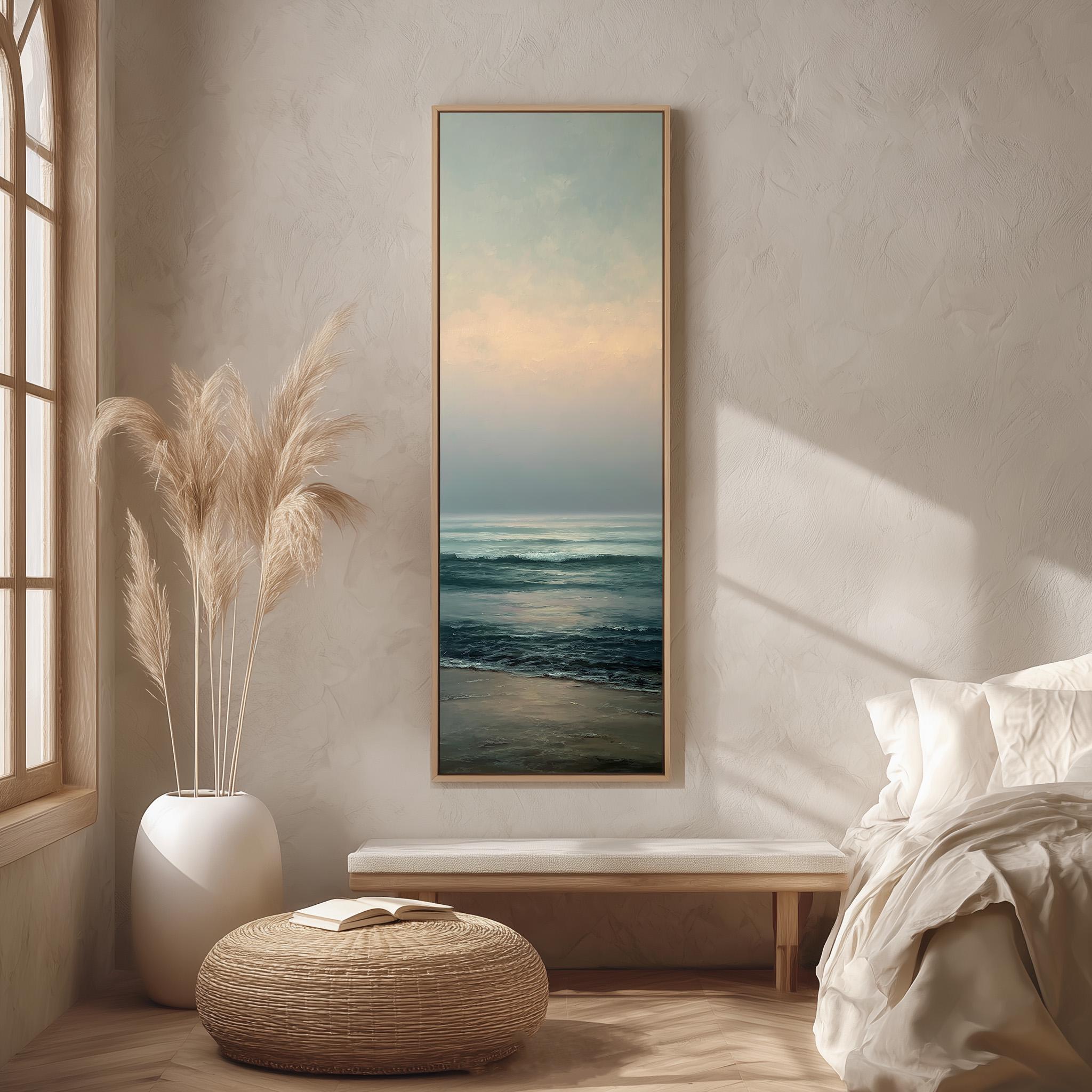 a serene bedroom scene with a large window, a painting of a beach, a white bed, a wicker ottoman, and a potted plant.