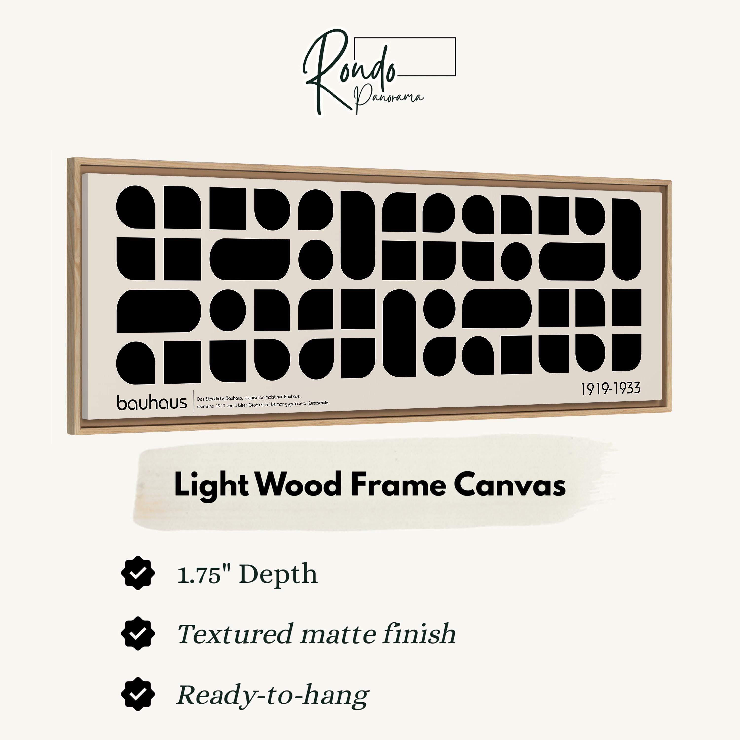 The image is a framed artwork featuring a minimalist design with a geometric pattern of black shapes on a light wood frame.