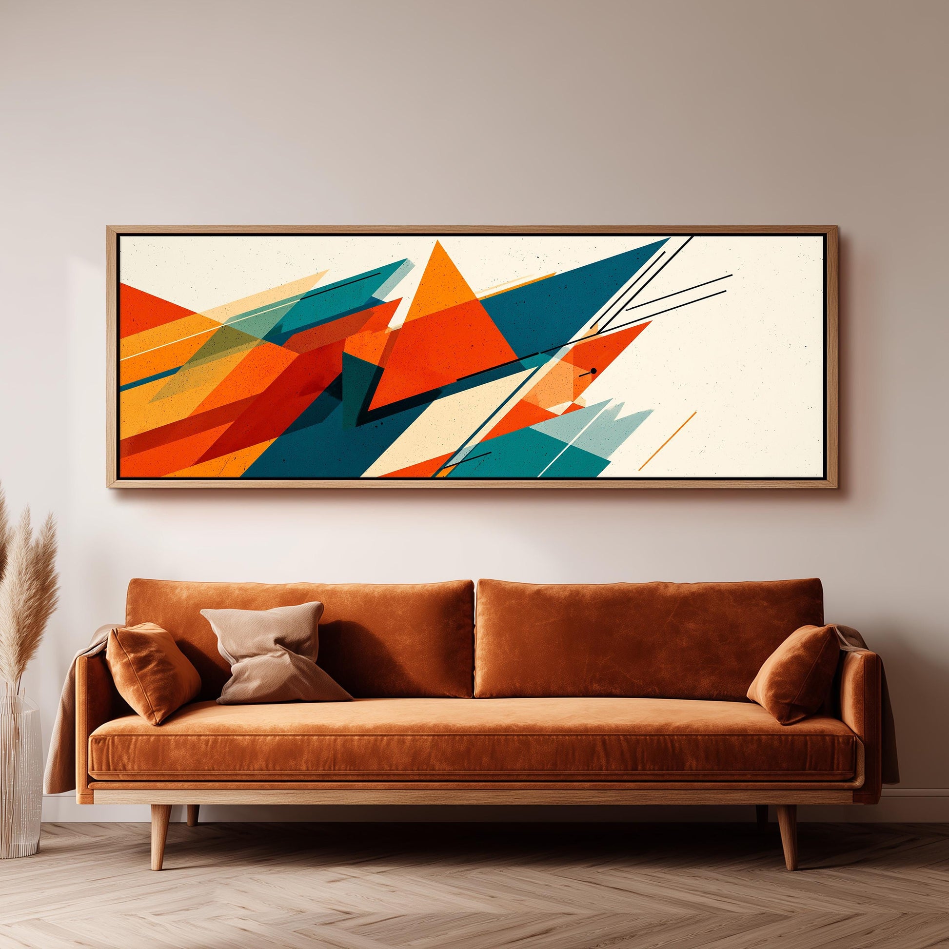 a large abstract painting hanging on a wall above a brown sofa in a living room setting.