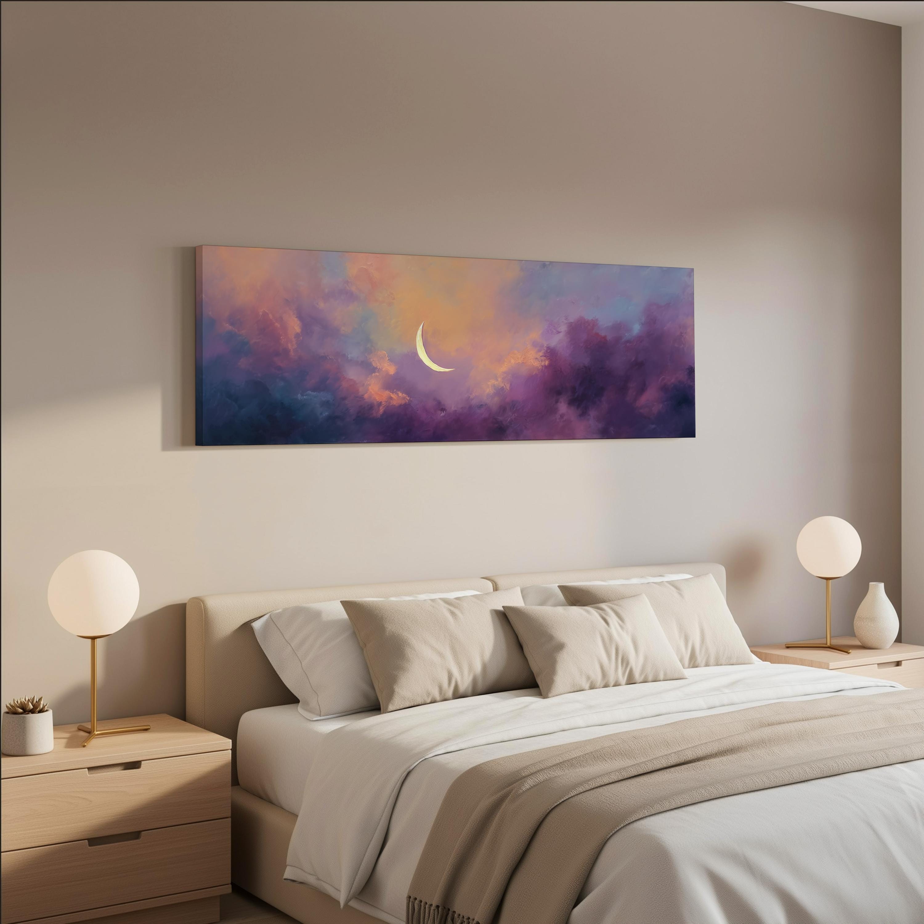 a serene bedroom scene with a large bed adorned with white linens and beige pillows, flanked by two white lamps on nightstands. Above the bed hangs a large painting of a crescent moon against a vibrant, colorful sky.