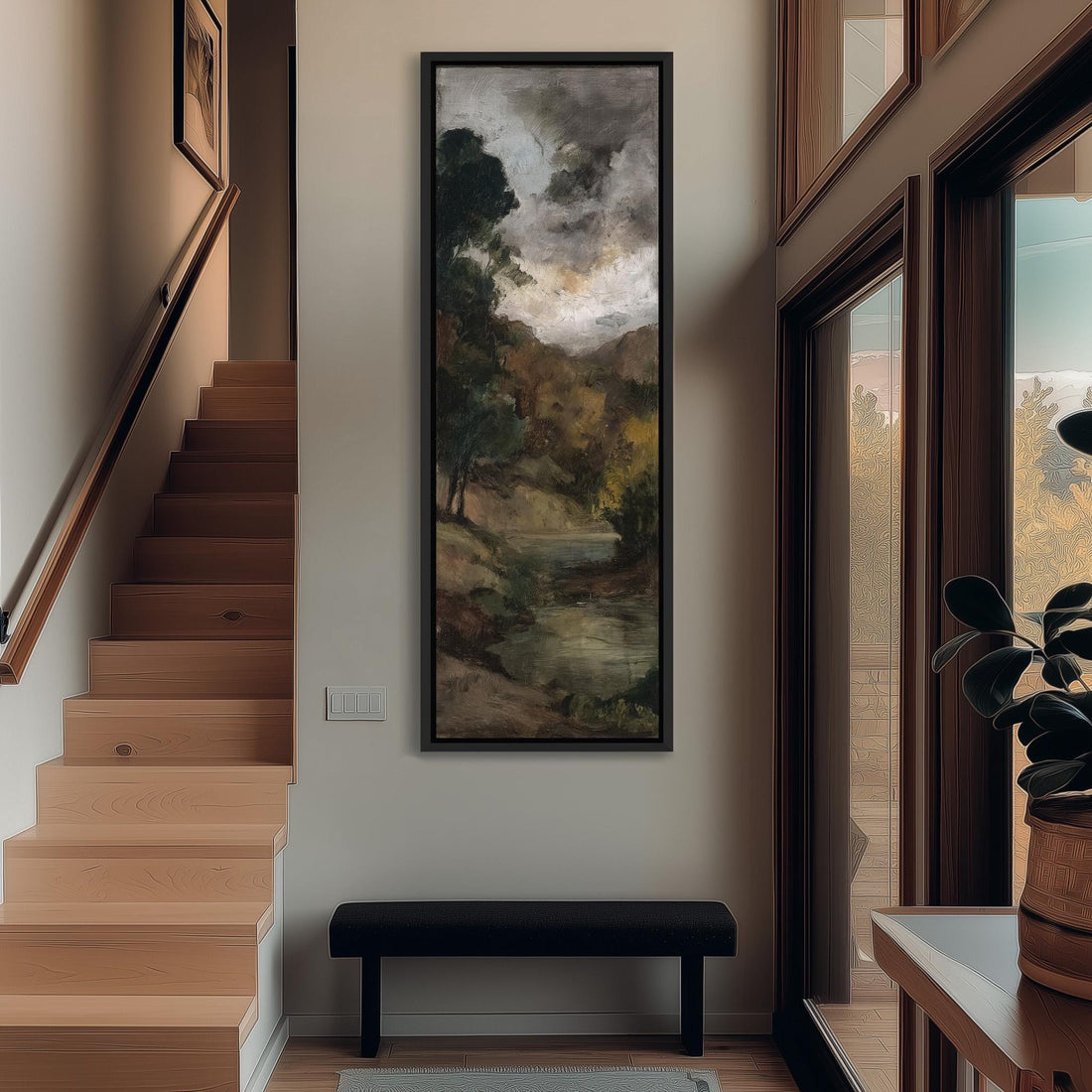 a hallway with a large painting of a landscape hanging on the wall, a wooden staircase, a bench, and a plant in a pot.