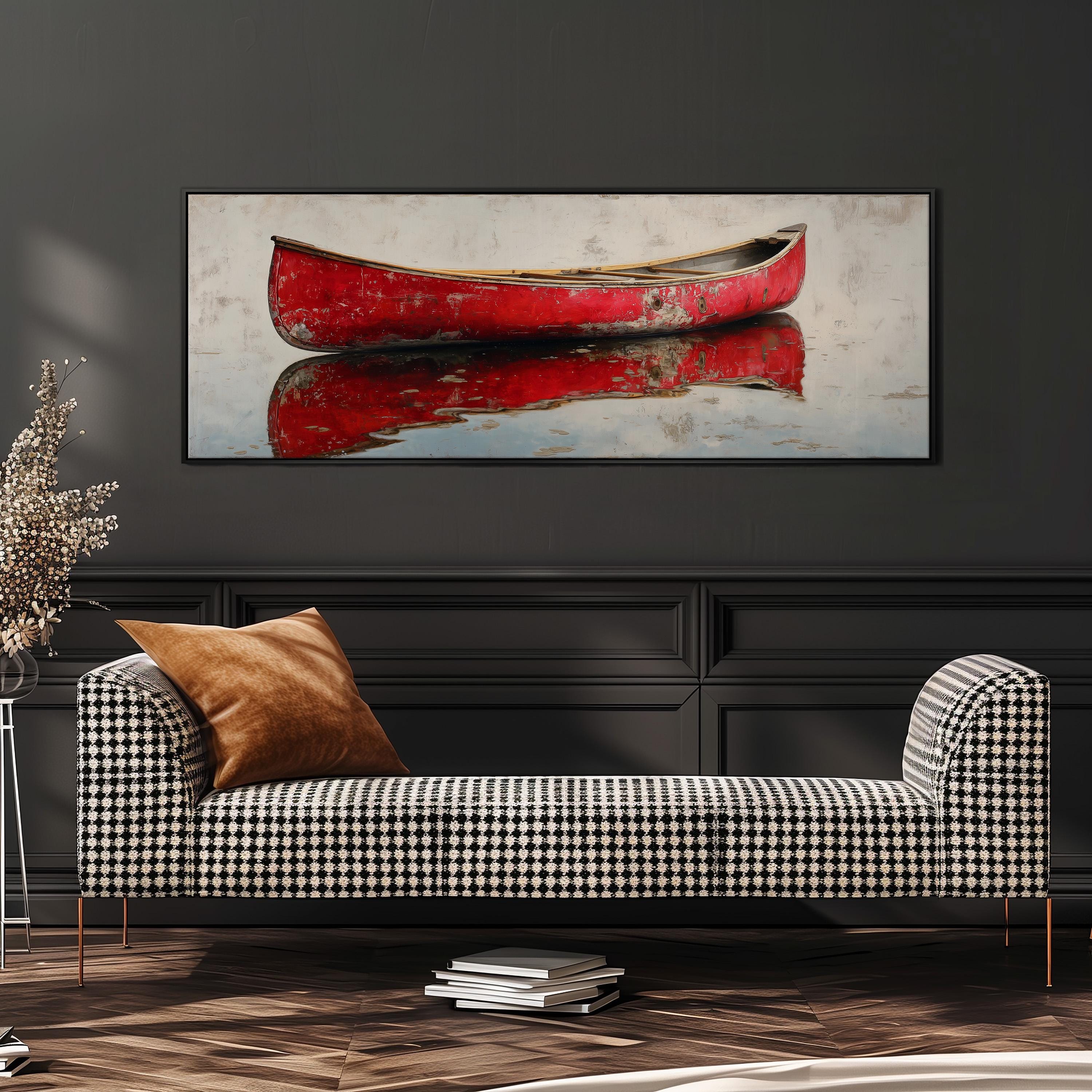 a large, framed painting of a red canoe on a wall, with a black and white checkered sofa in the foreground.