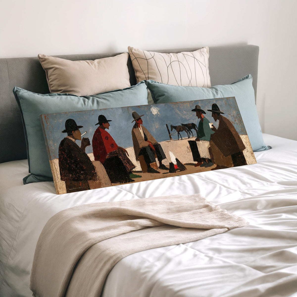 Cowboys gathered around a campfire wide panoramic canvas print laid on a bed to show its size