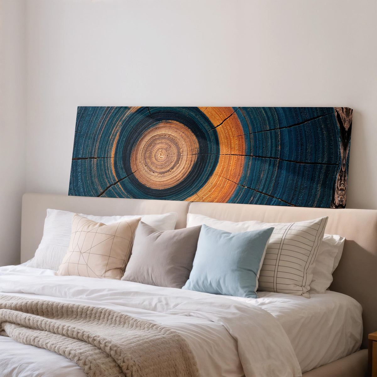 Teal and orange tree ring wide panoramic canvas print above a bed in a bedroom