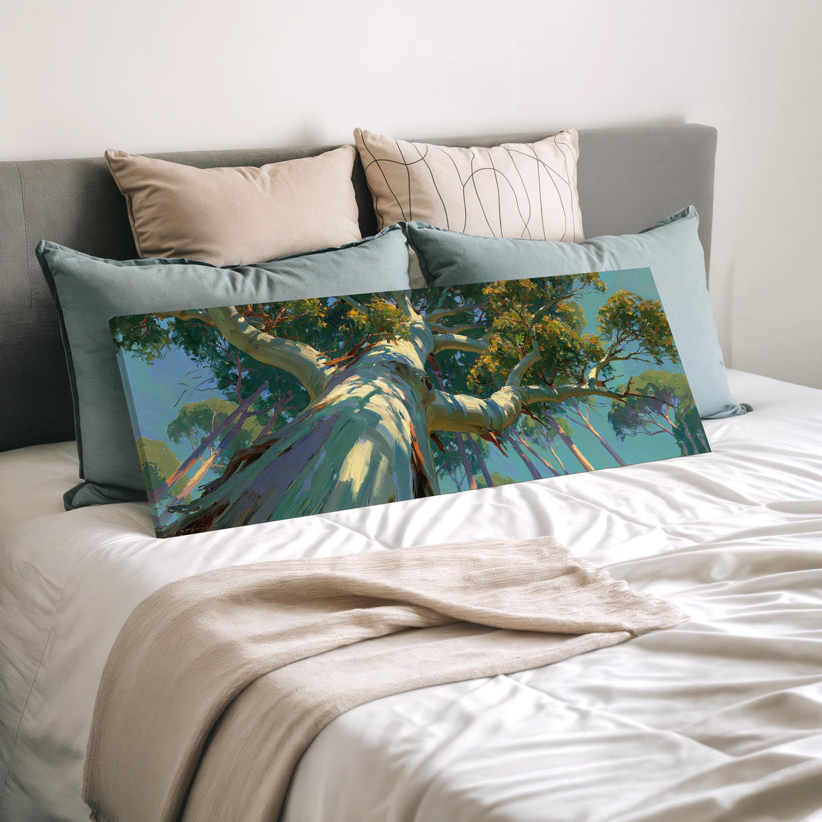 Eucalyptus canopy against a blue sky wide panoramic canvas print laid on a bed to show its size