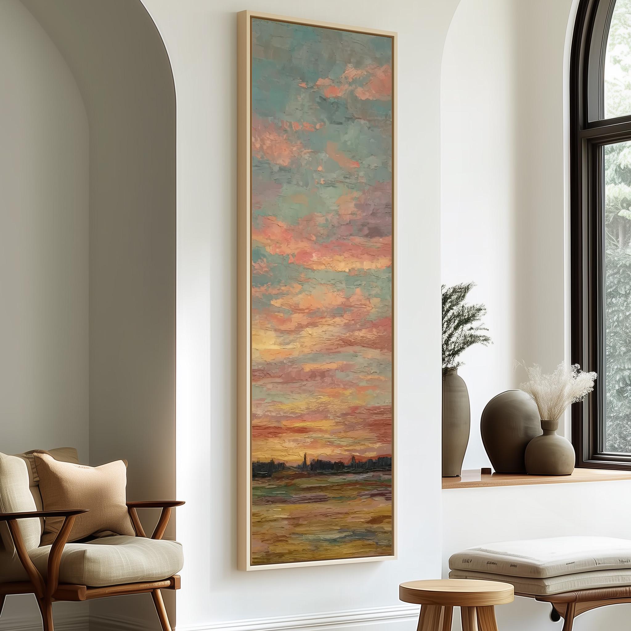 a large painting of a sunset hanging on a wall, with a wooden chair and a small table in the foreground.