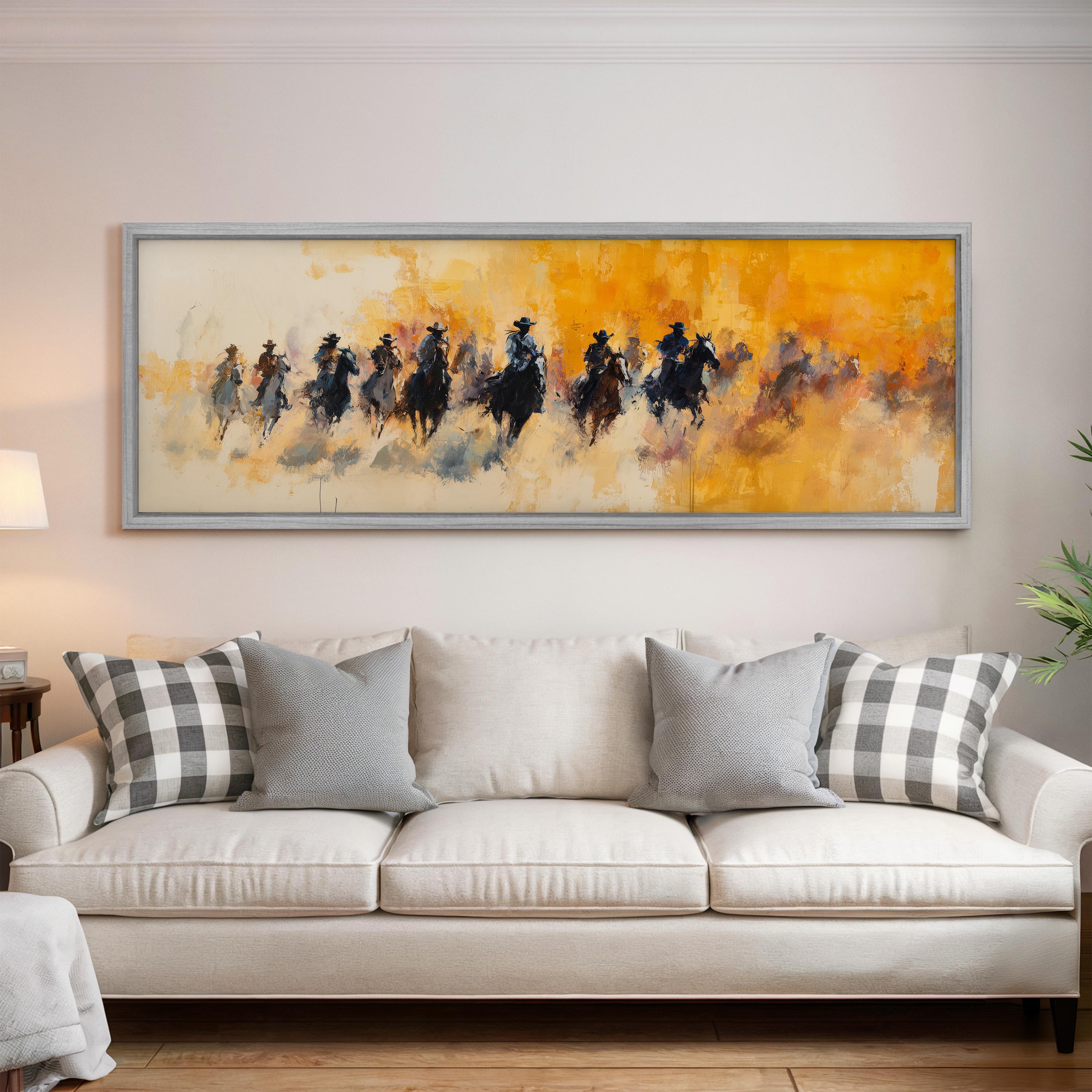 a large painting of a group of people riding horses, hanging on a wall above a white couch with gray and white plaid throw pillows.