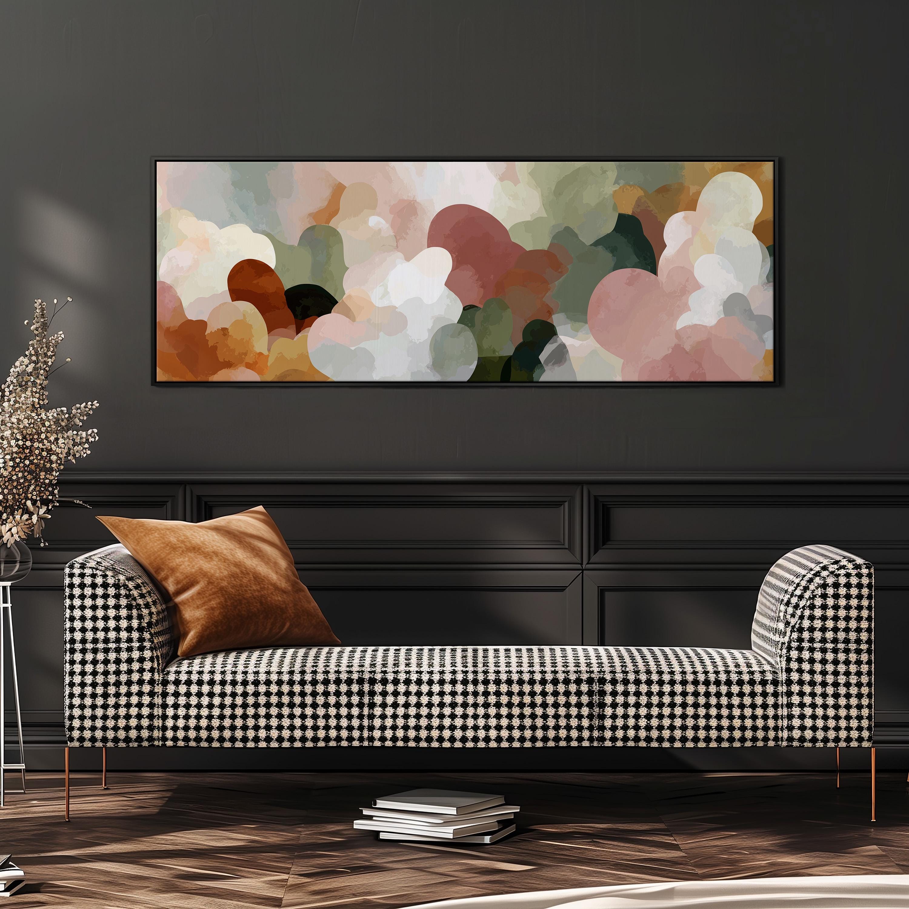 a modern living room with a black and white checkered sofa, a stack of books, and a large abstract painting hanging on the wall above the sofa.