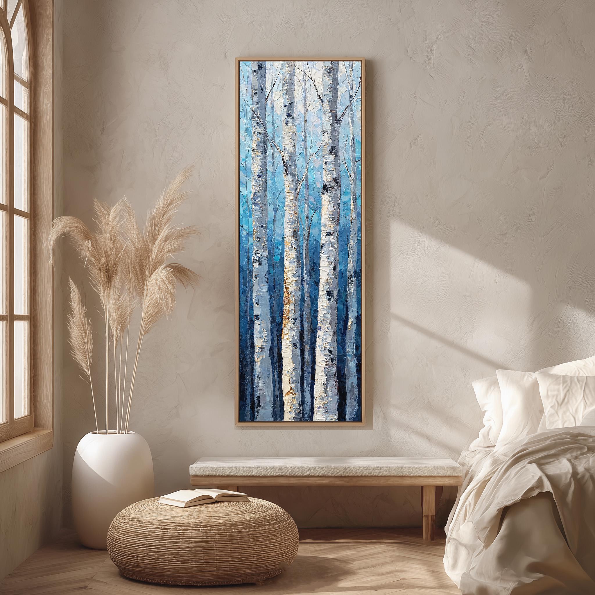 a serene bedroom scene with a large painting of birch trees hanging on the wall, a white bed with a white pillow, a white vase with tall potted plants, and a woven ottoman in front of the bed.