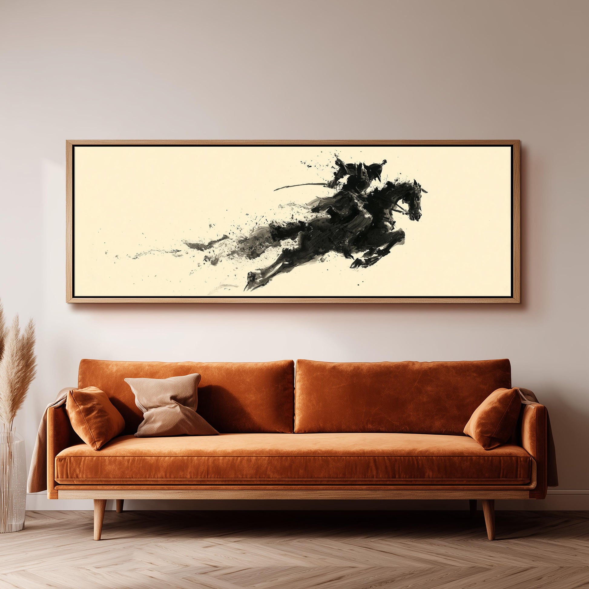 a large, framed artwork depicting a horse in mid-gallop, hanging on a wall above a brown sofa.