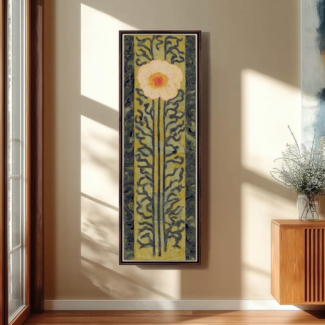 a large, colorful painting of a flower hanging on a wall, with a wooden chair and a small table in the foreground.