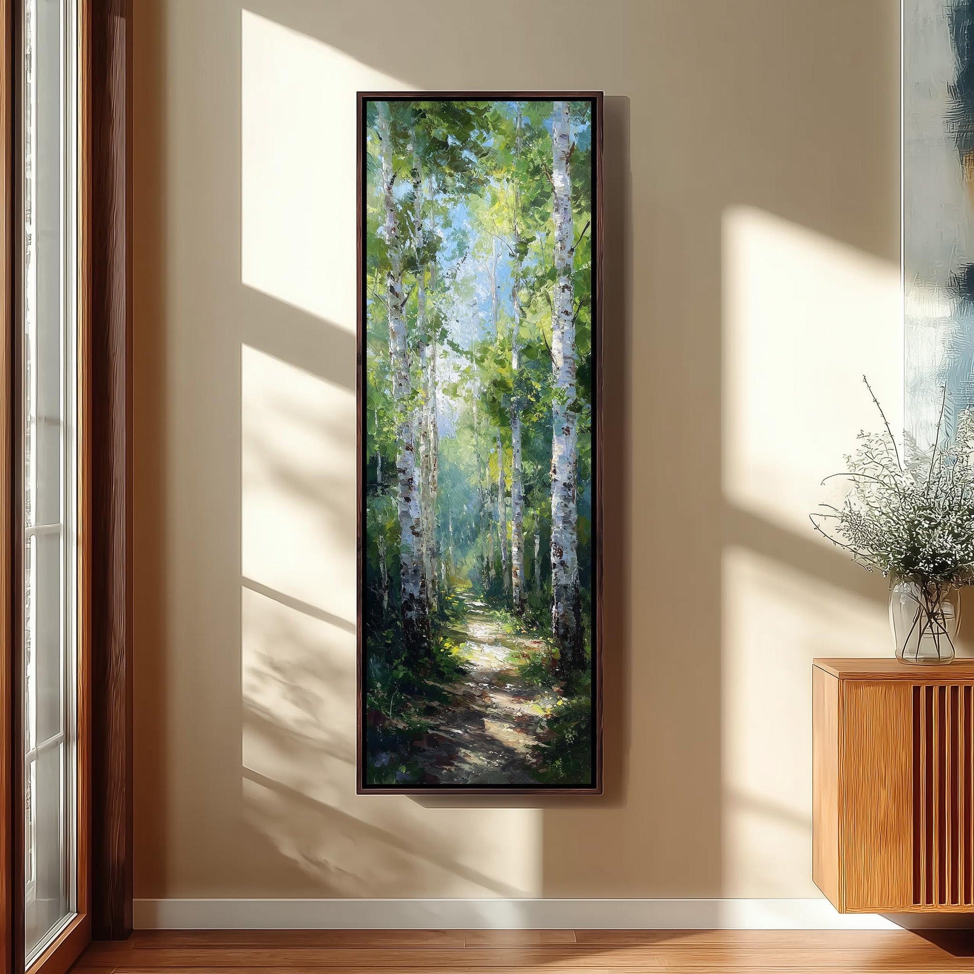 a large painting of a forest scene hanging on a wall, with sunlight streaming through the windows and casting shadows on the wall.