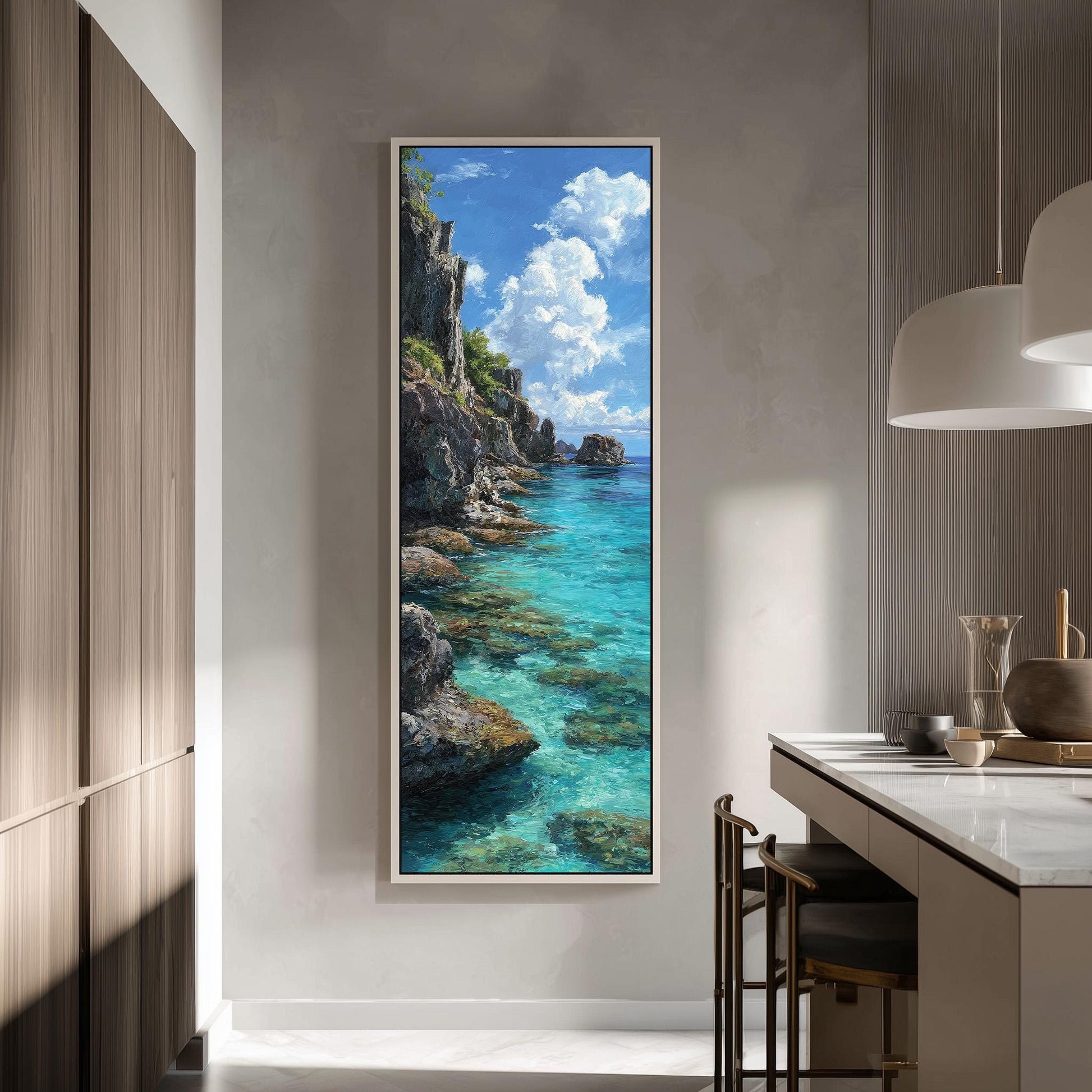 a large framed painting of a serene coastal landscape with turquoise waters, rocky cliffs, and a bright blue sky with fluffy white clouds.