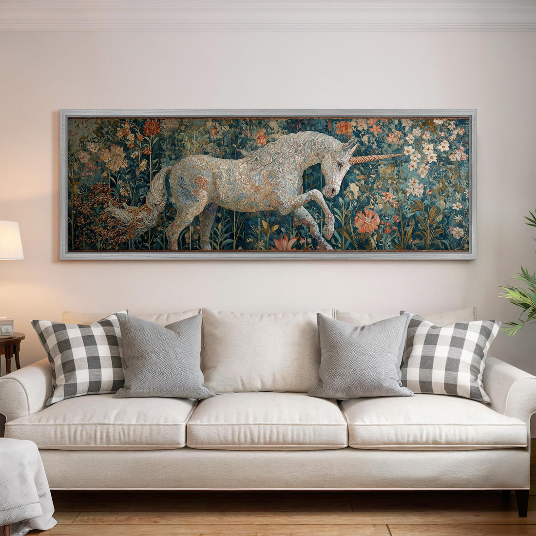 a large painting of a unicorn in a field of flowers, hanging on a wall above a black and white checkered sofa.