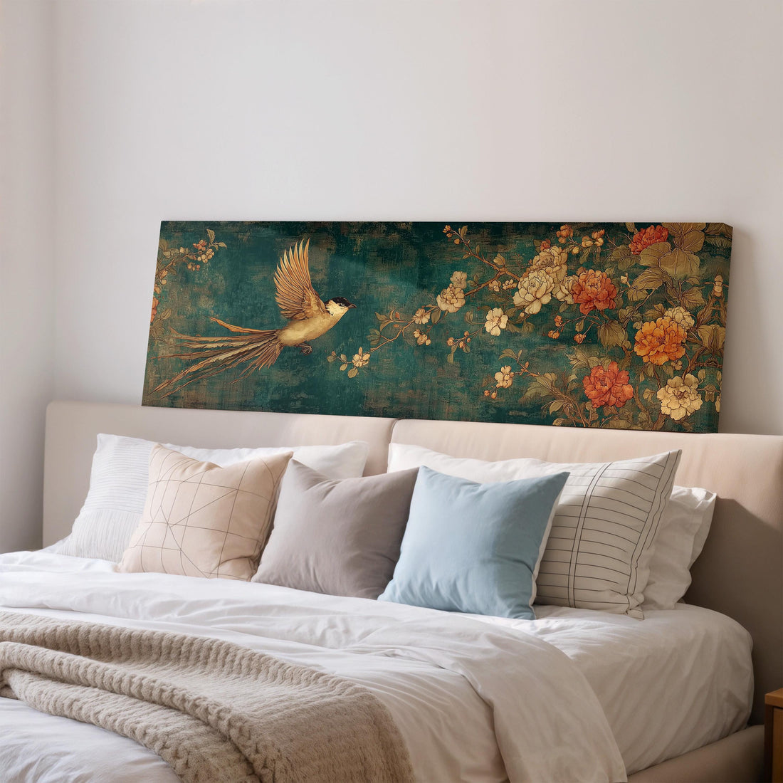 a large, ornate painting of a bird in flight above a brown sofa in a living room setting.