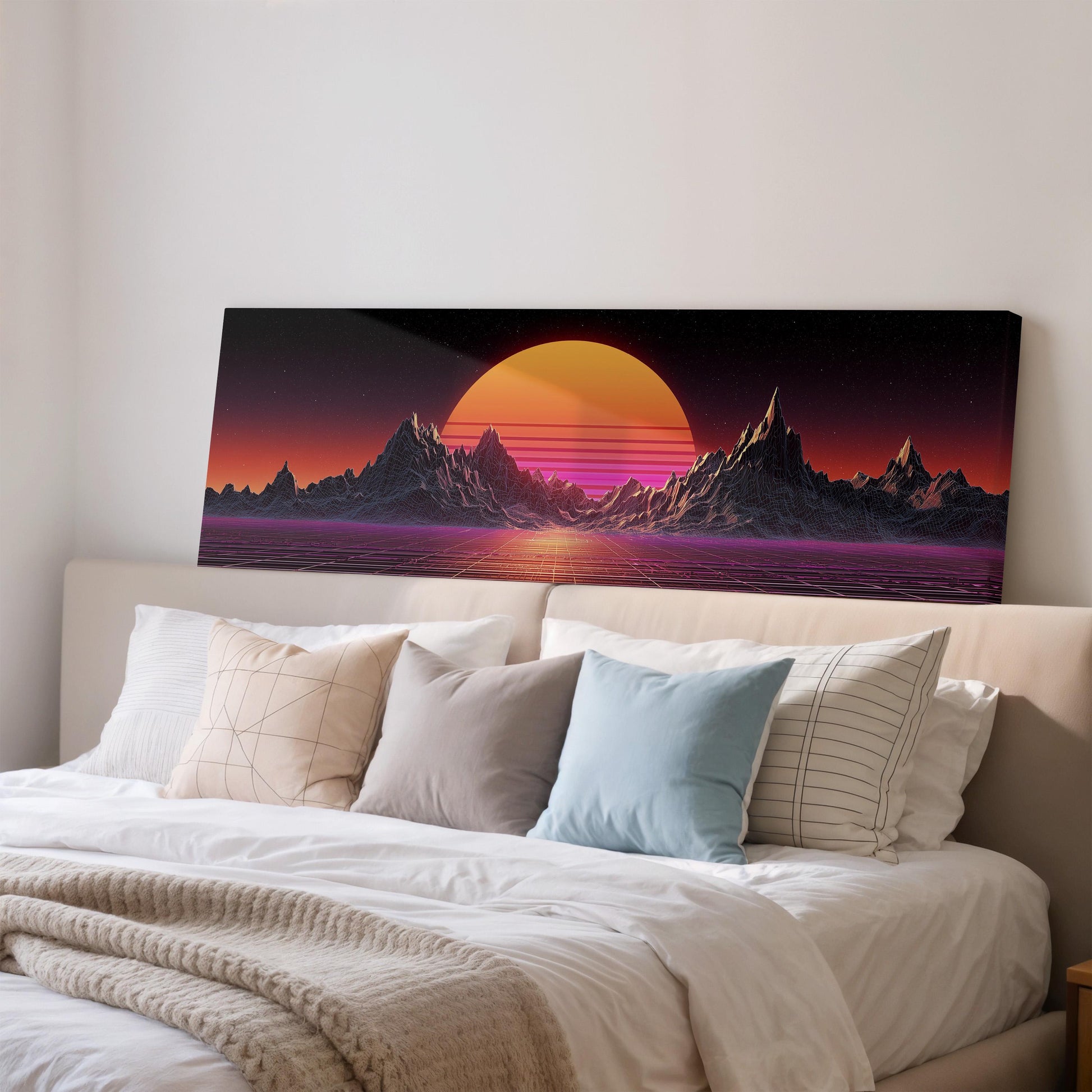 a large, colorful painting of a sunset over mountains, displayed on a wall above a bed with white bedding.