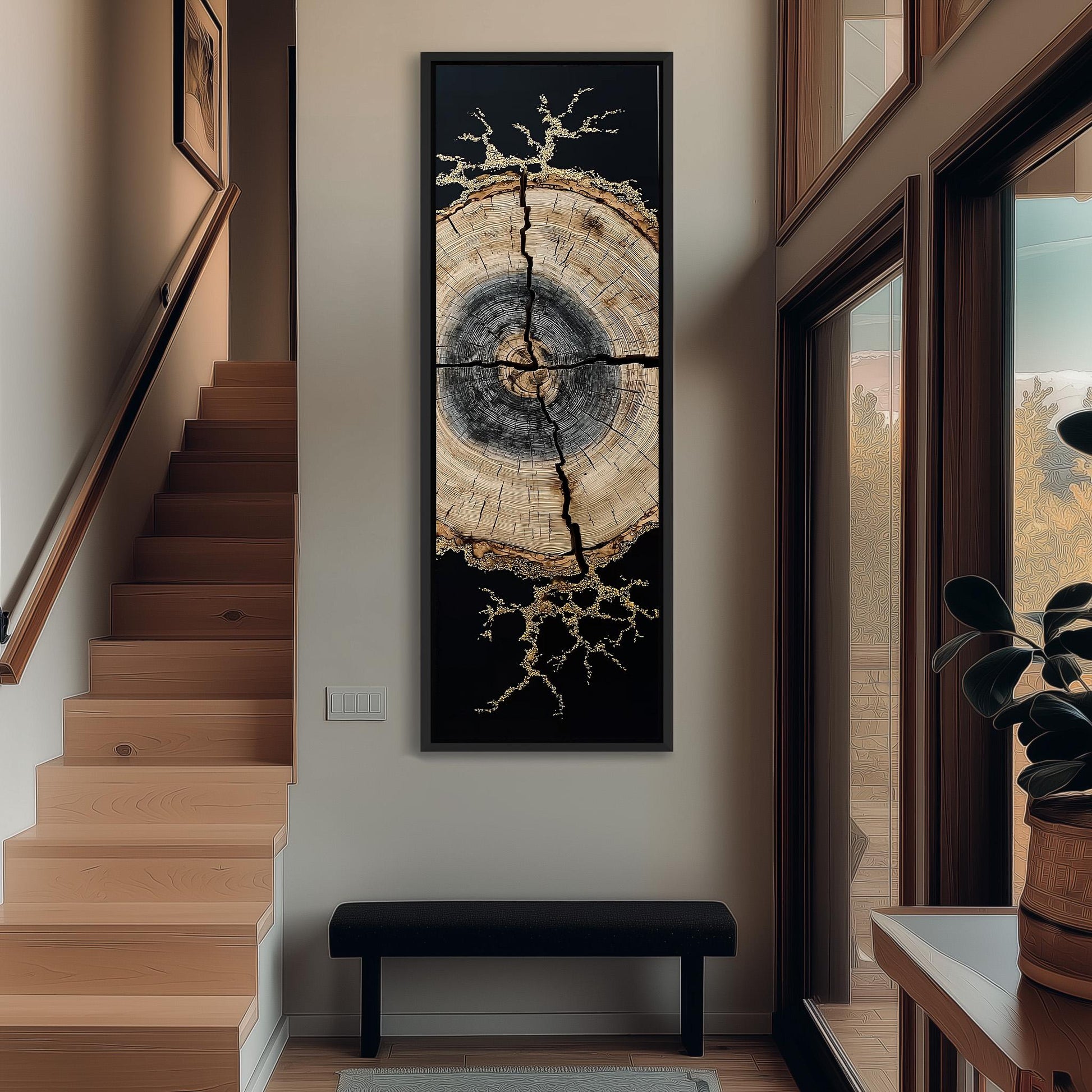 a wooden staircase with a large, abstract painting hanging on the wall above it. The painting depicts a tree trunk with a striking black and white design, creating a striking contrast against the white wall. The staircase leads up to a window, providing a view of the outdoors.