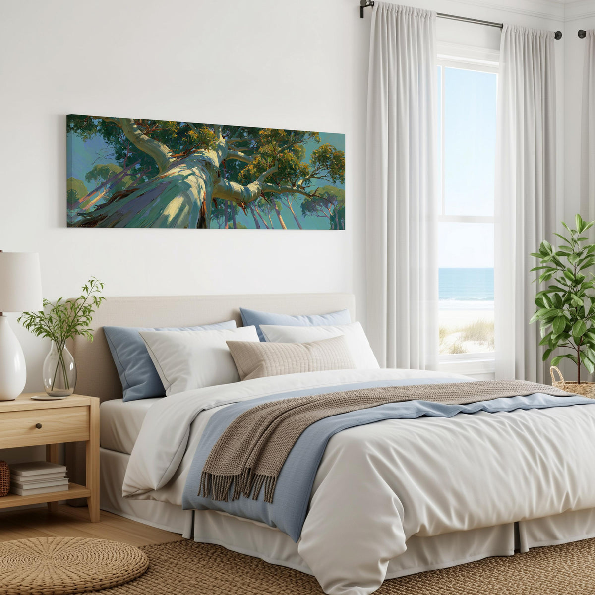 Eucalyptus canopy against a blue sky panoramic canvas print above a bed in a coastal bedroom