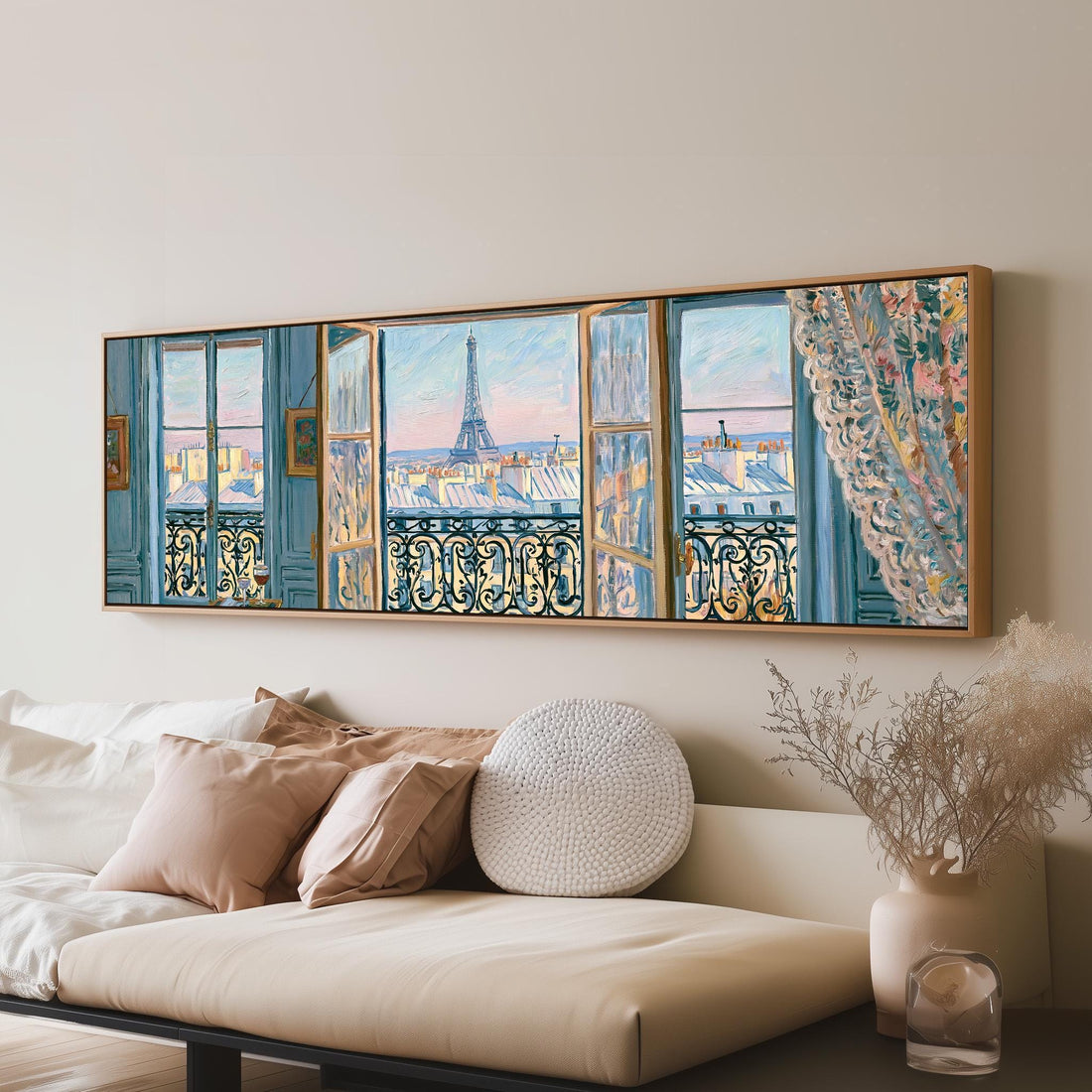 Eiffel Tower seen through a blue Paris window long horizontal canvas print above a sofa in a living room