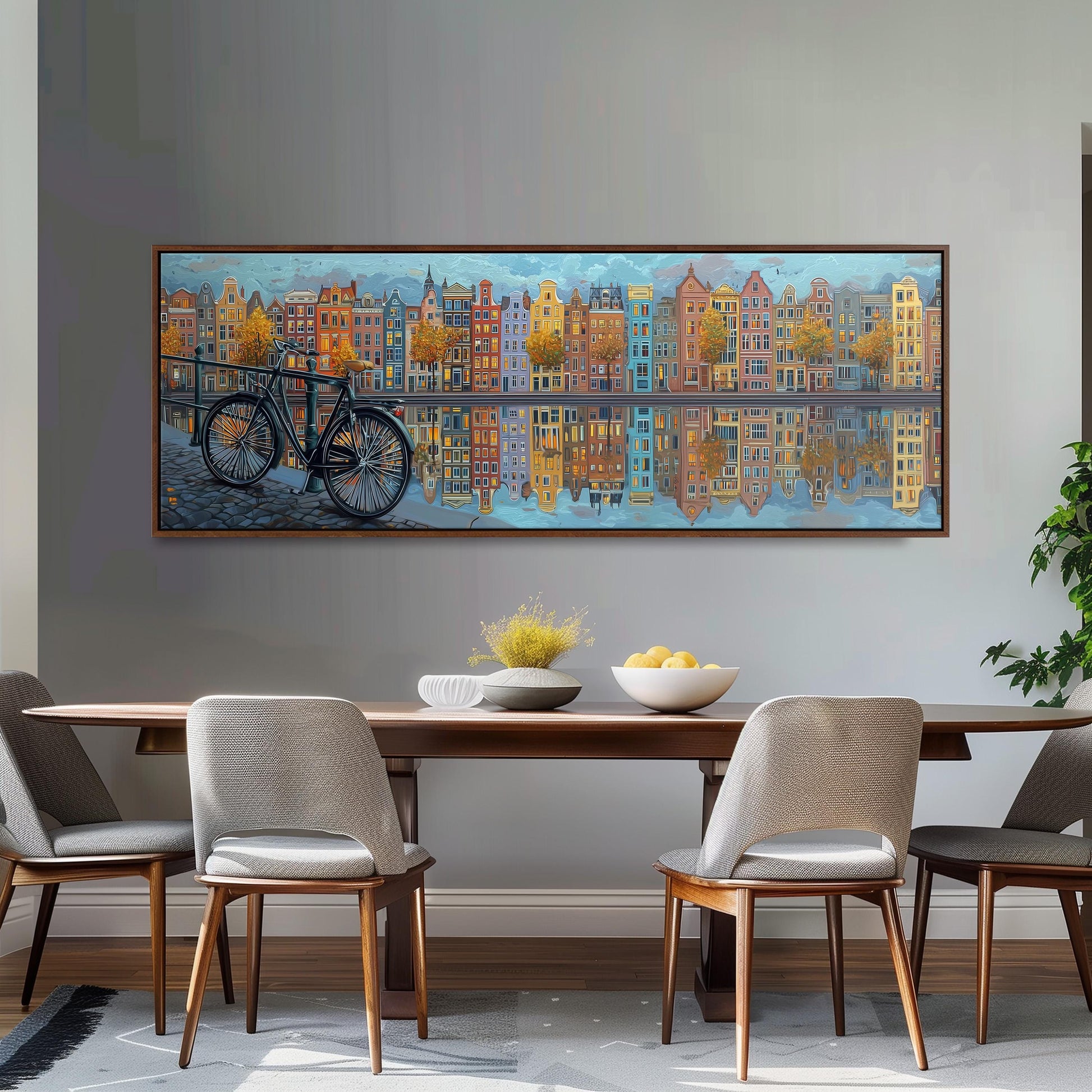 a large painting of a cityscape with a bicycle in the foreground, hanging on a wall above a wooden dining table with four chairs.