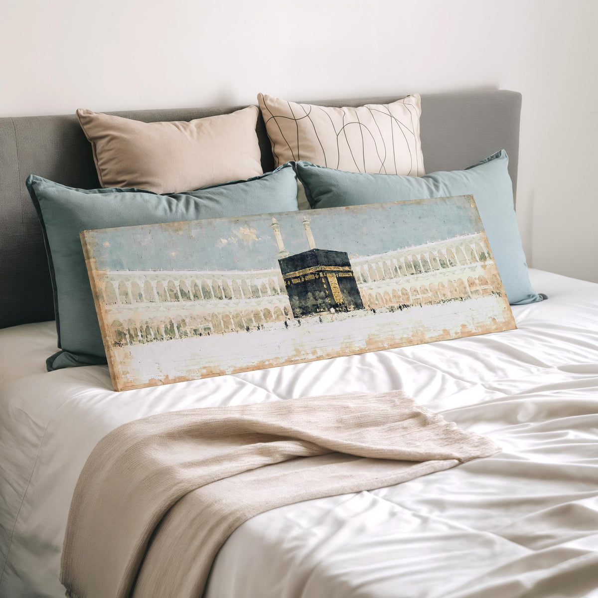 The Kaaba in the Grand Mosque courtyard wide panoramic canvas print laid on a bed to show its size