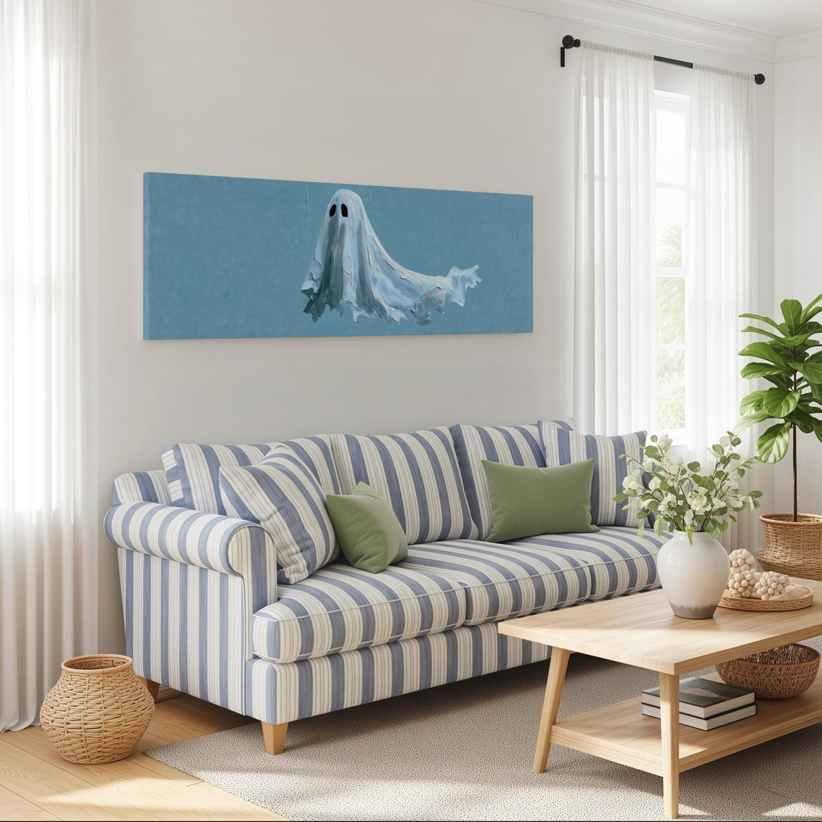 Floating ghost on blue long horizontal canvas print above a striped sofa in a coastal living room