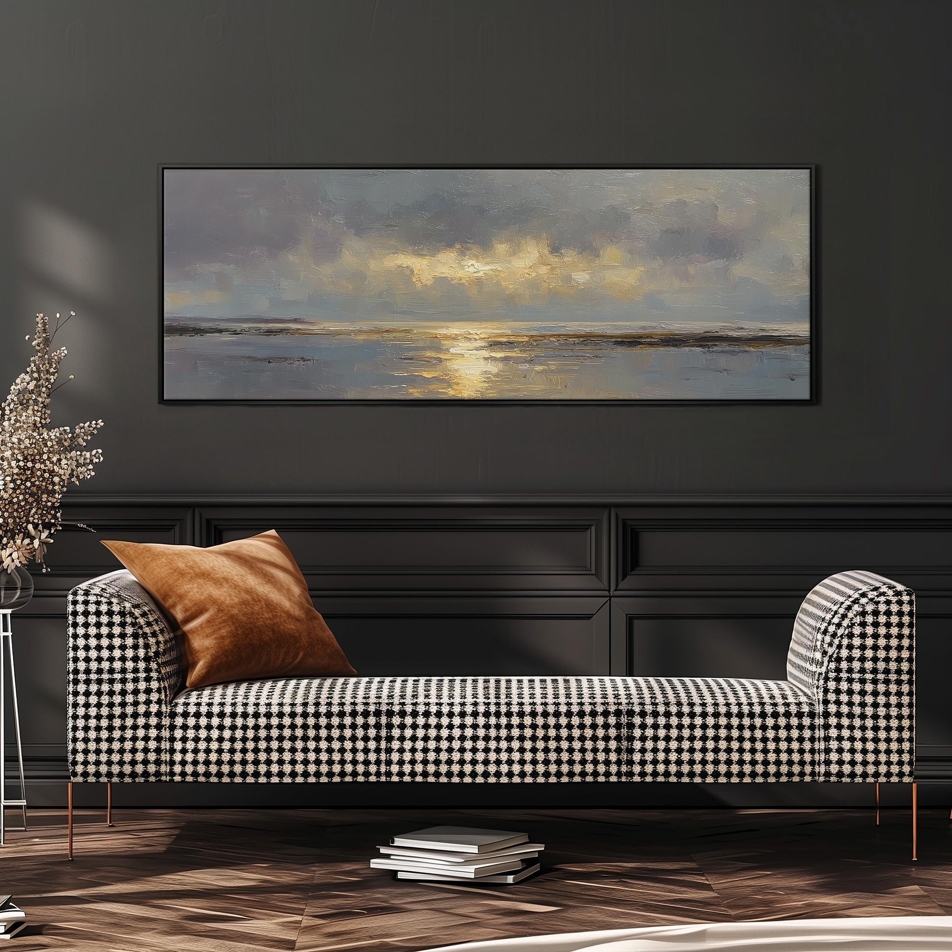 a large painting of a serene landscape hanging on a dark wall above a black and white checkered sofa with a brown throw pillow.