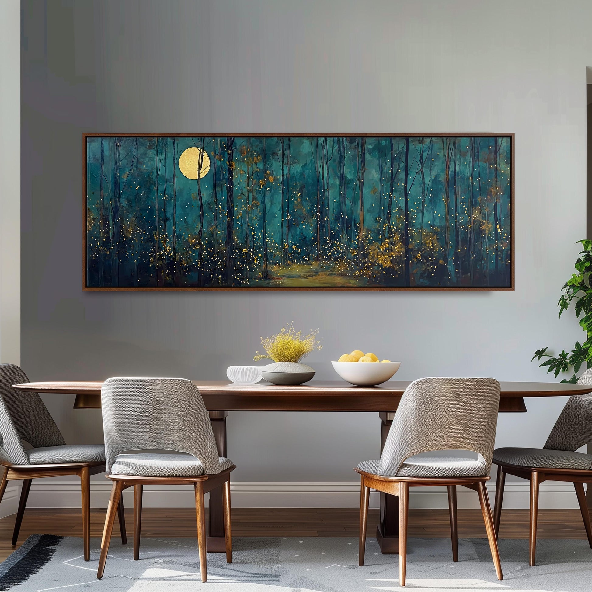 a dining room with a large painting of a forest scene hanging on the wall above a wooden table with four chairs. The painting depicts a serene night scene with a full moon illuminating the trees and a path leading through the forest.