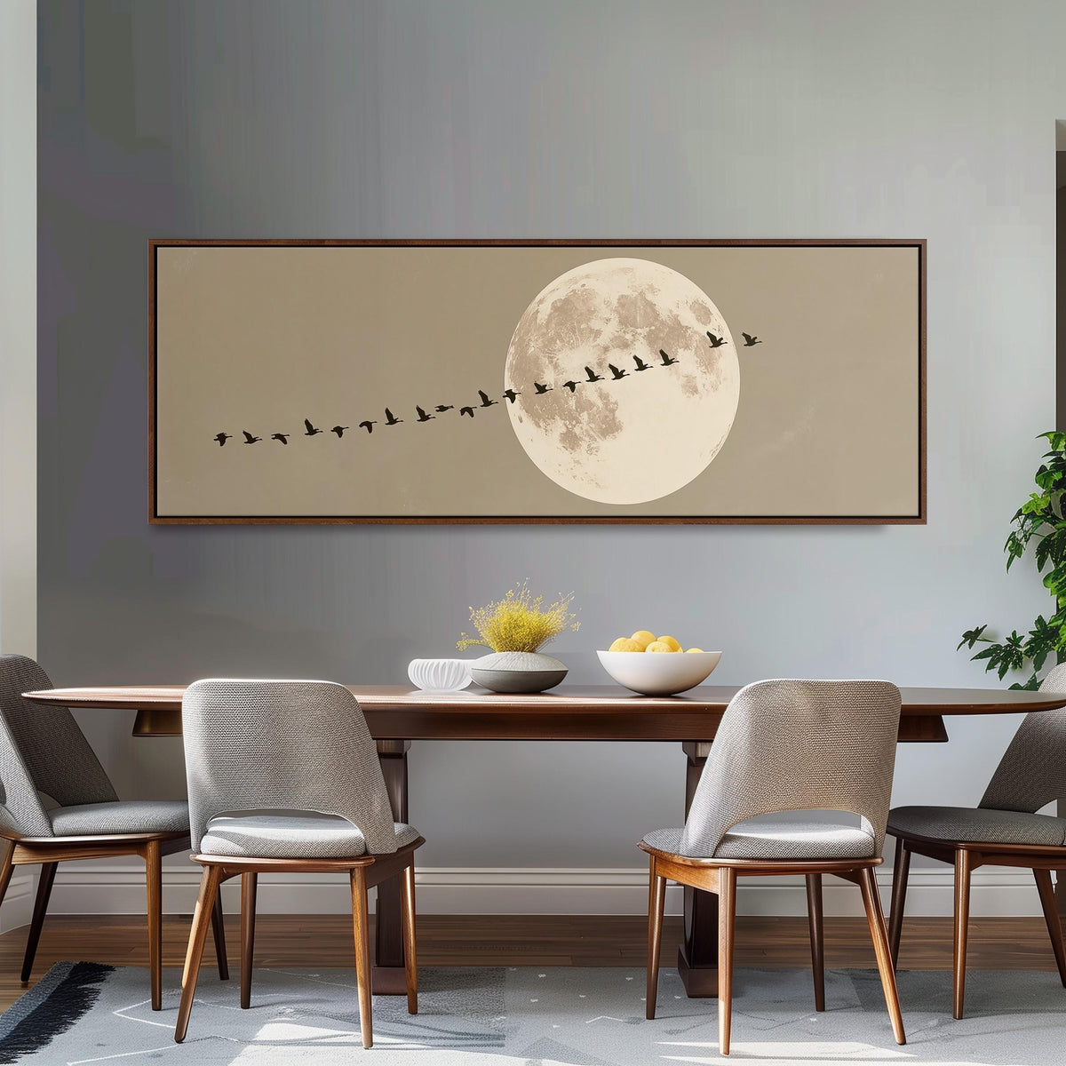 Geese flying past a full moon long horizontal canvas print above a dining table