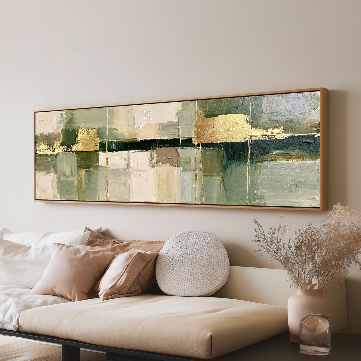 Sage and gold leaf abstract panoramic canvas print above a sofa in a living room