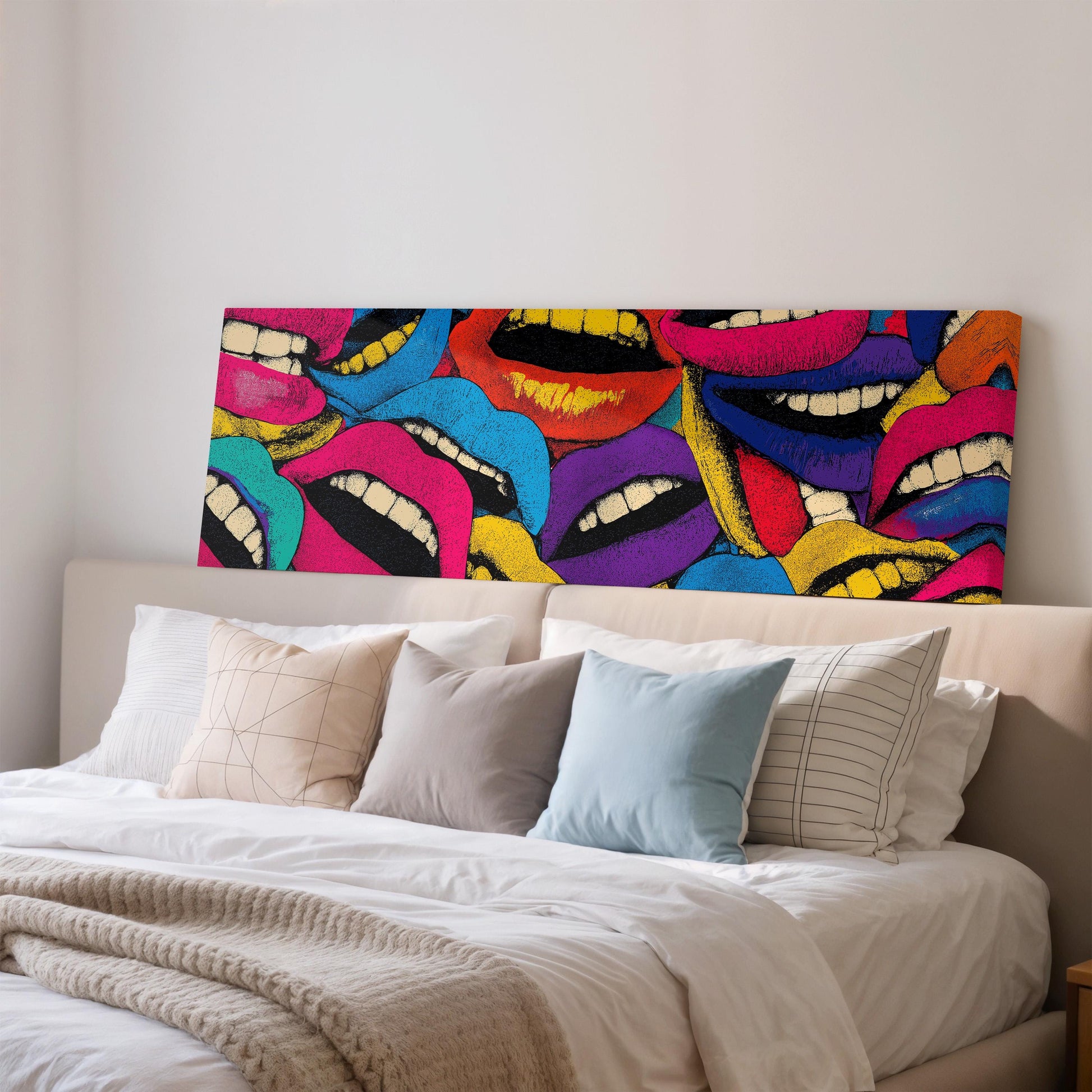 a large, colorful painting of multiple lips on a wall above a bed with white bedding and pillows.