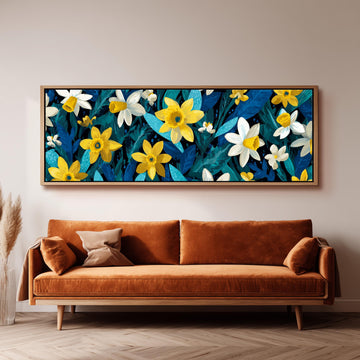 a large, vibrant painting of yellow and white flowers hanging on a wall above a brown sofa.