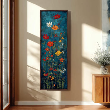 a large, colorful painting of flowers hanging on a wall in a room with a wooden cabinet below it.