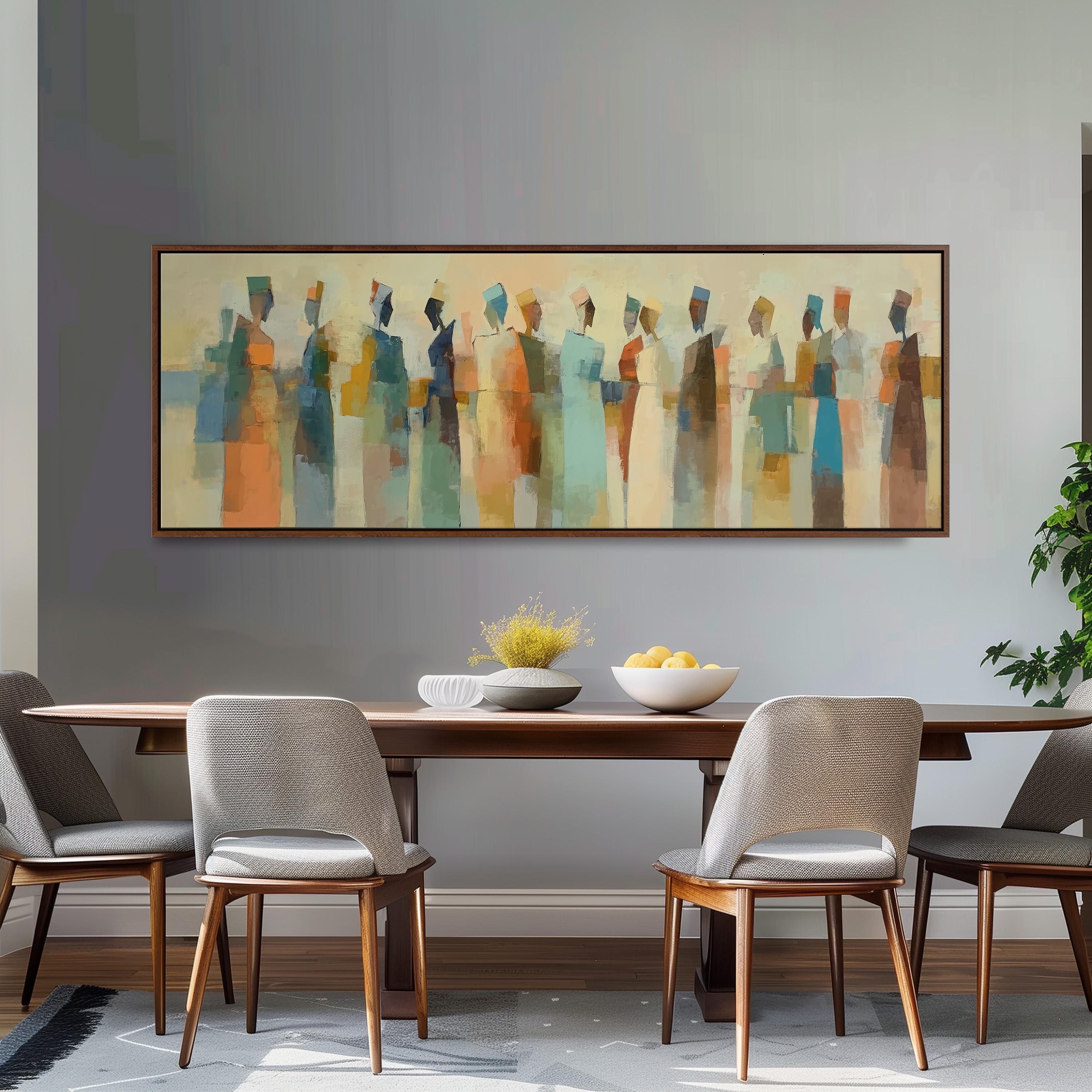 a dining room with a large abstract painting hanging on the wall above a wooden table with four chairs. The table is set with a bowl of fruit and a vase of flowers, creating a welcoming and stylish atmosphere.