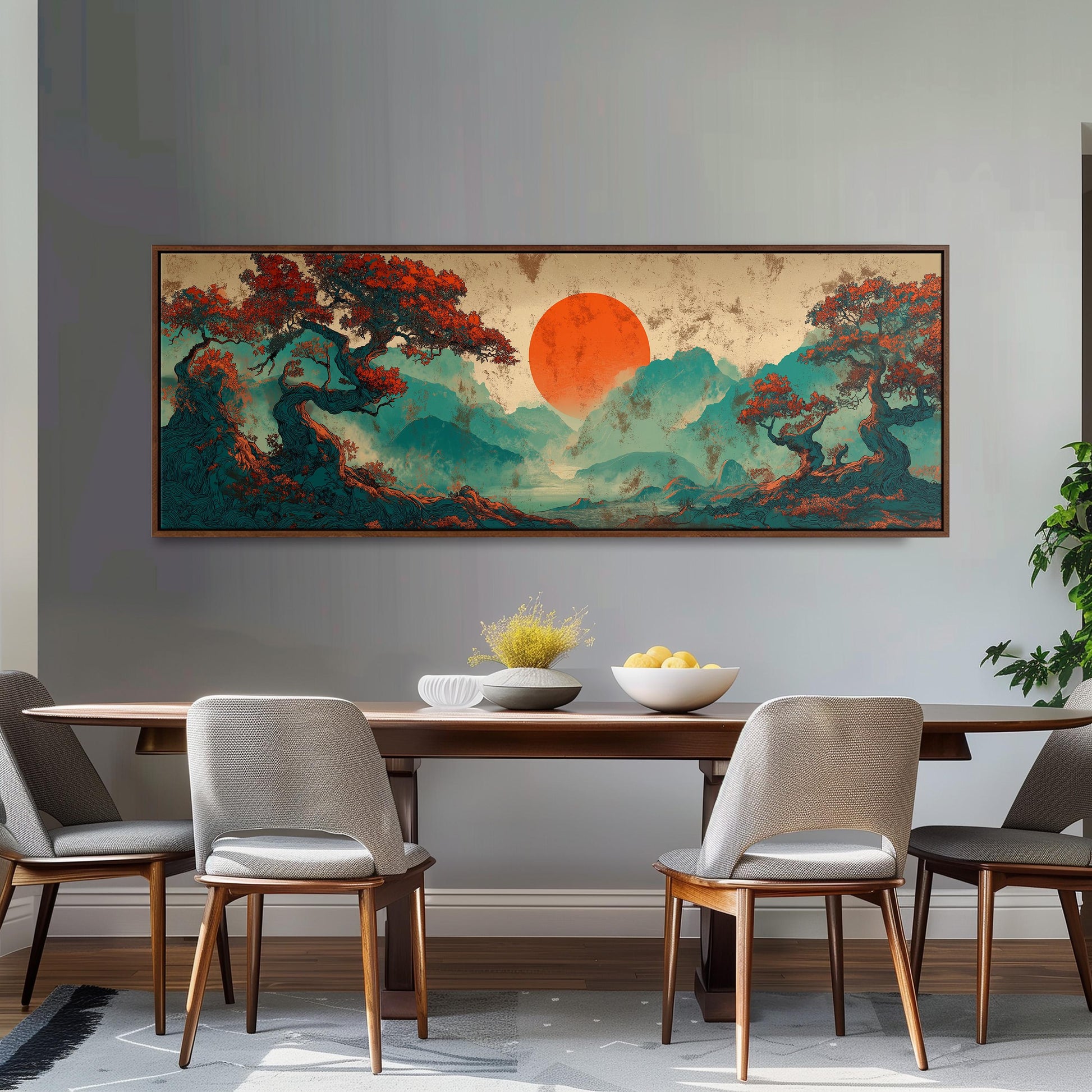 a dining room with a large, colorful painting of a landscape hanging on the wall above a wooden dining table with four chairs. The painting depicts a serene mountain scene with a prominent orange sun in the sky.