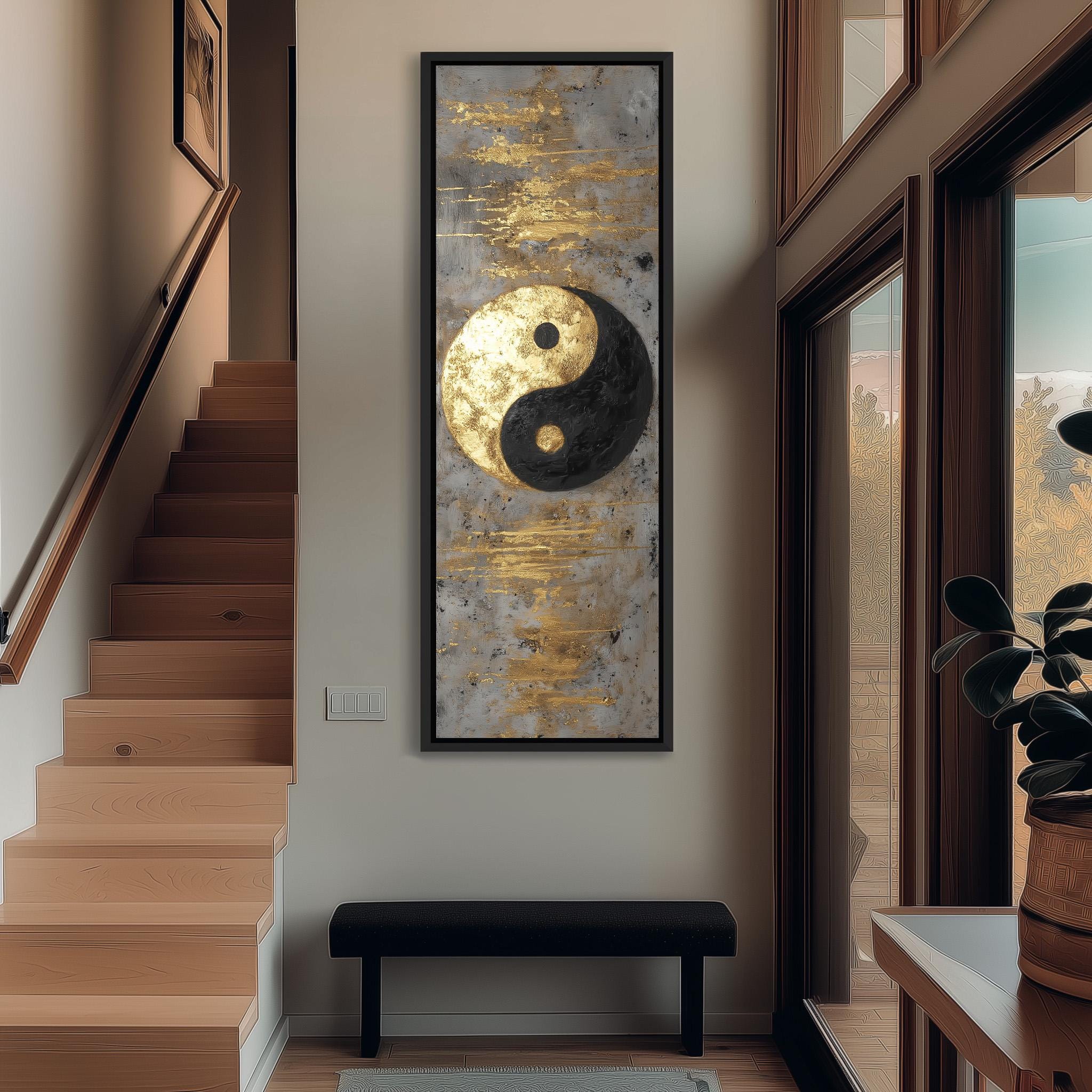 a modern interior design with a large framed artwork of a yin and yang symbol hanging on the wall, above a black bench. The artwork is surrounded by wooden stairs and a potted plant, creating a harmonious and balanced composition.