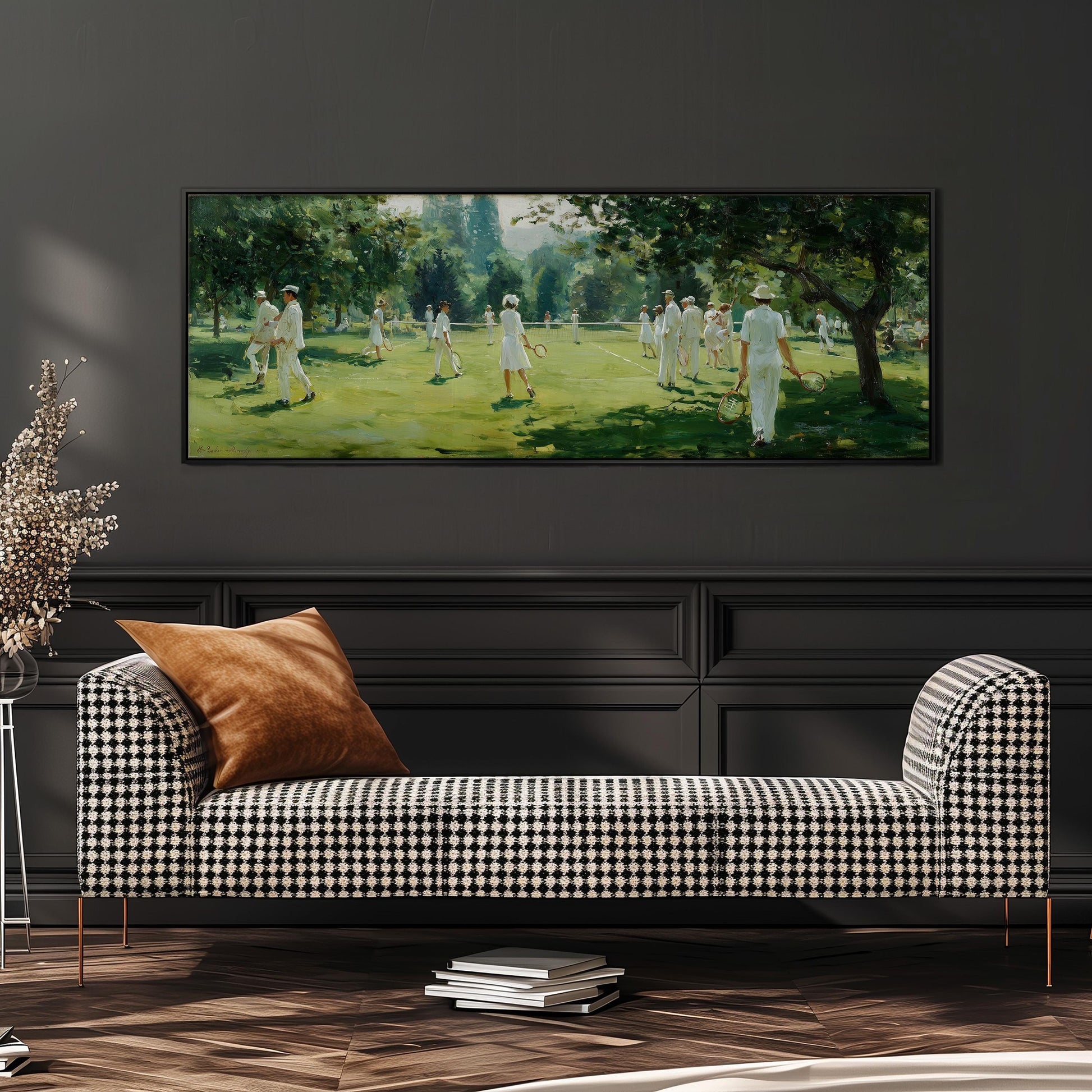 a large painting of a group of people playing cricket in a lush green field, hanging on a wall above a black and white checkered sofa.