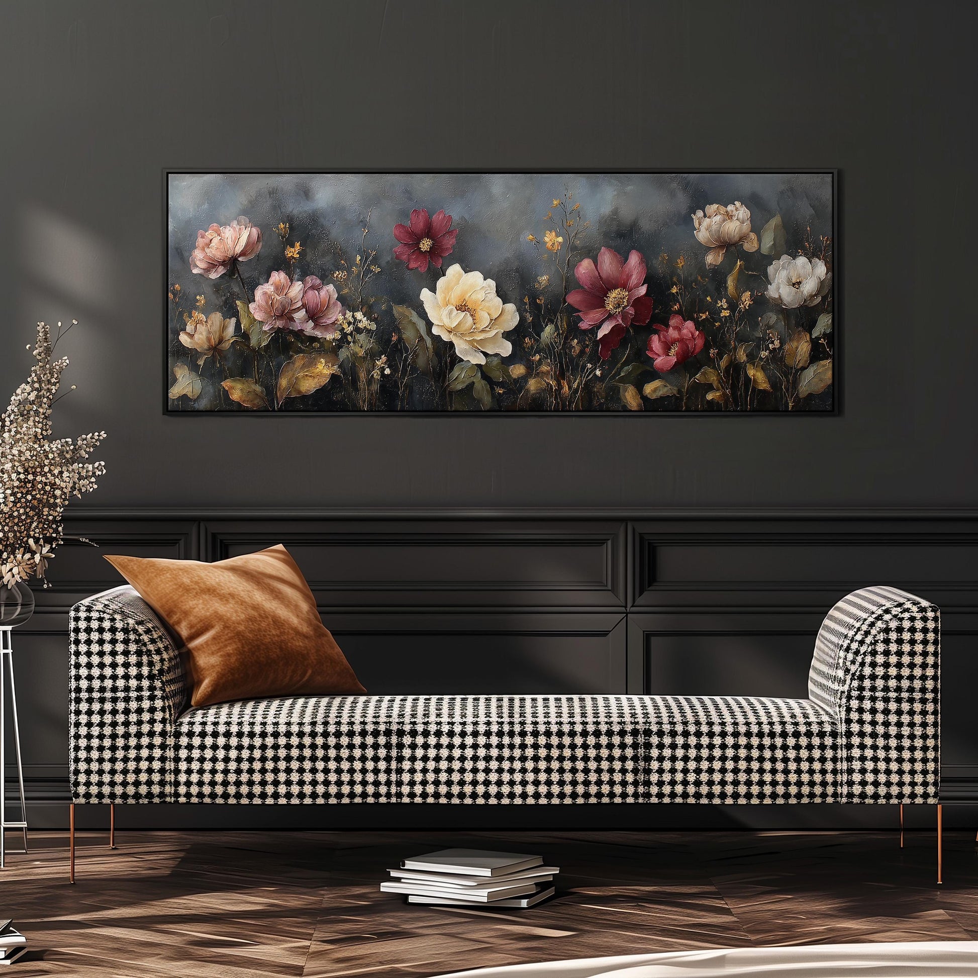 a large floral painting hanging on a wall above a black and white checkered sofa with a brown throw pillow.