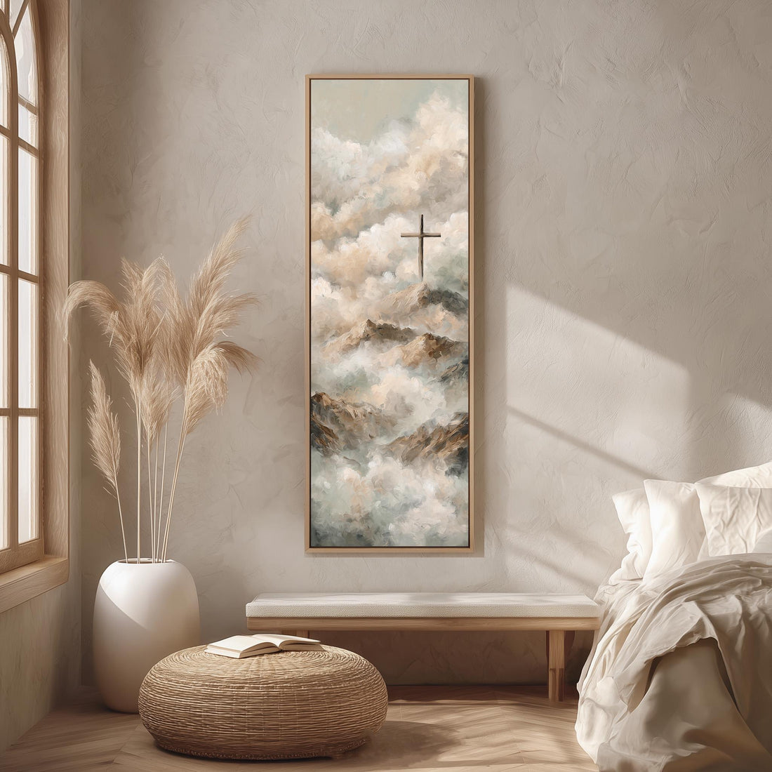 a serene bedroom scene with a large painting of clouds and a cross hanging on the wall. The painting is framed in a white frame and is the focal point of the room. The room features a bed with white bedding, a wicker ottoman, and a potted plant. The overall color scheme of the room is neutral, with the white frame and the painting adding a touch of color and contrast.