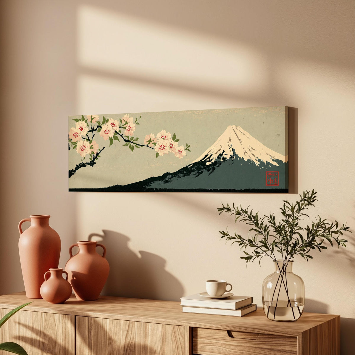Cherry blossom branch and Mount Fuji long horizontal canvas print above a wooden sideboard