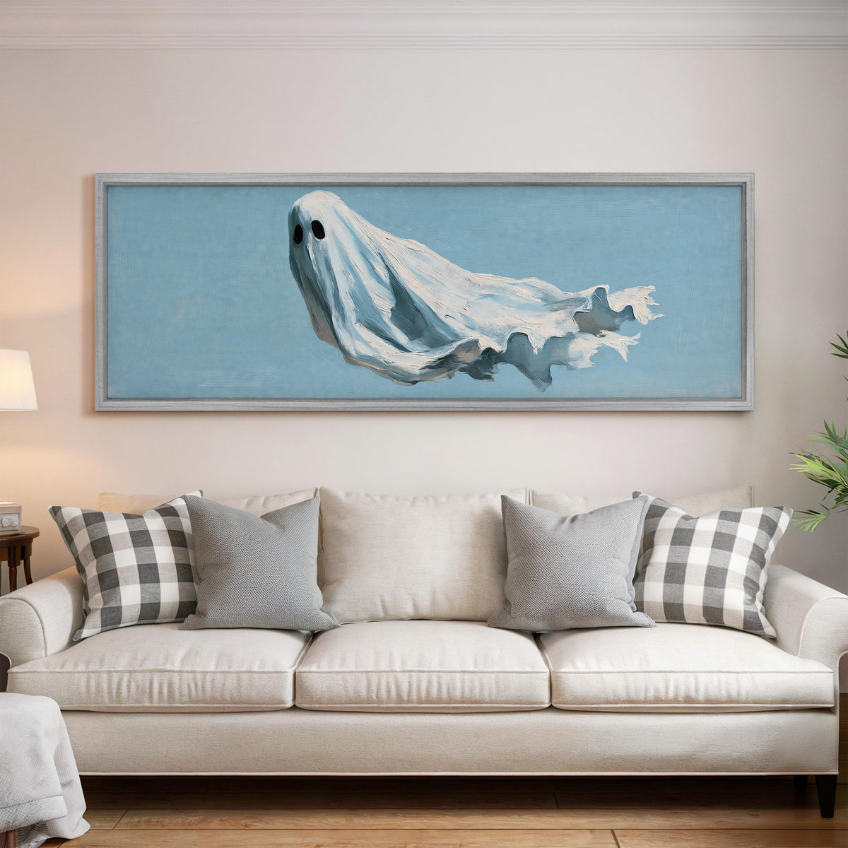 Drifting ghost spirit panoramic canvas print above a white sofa in a bright living room