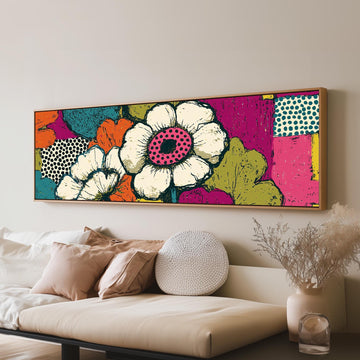 Bold pop blossoms long horizontal canvas print above a sofa in a living room