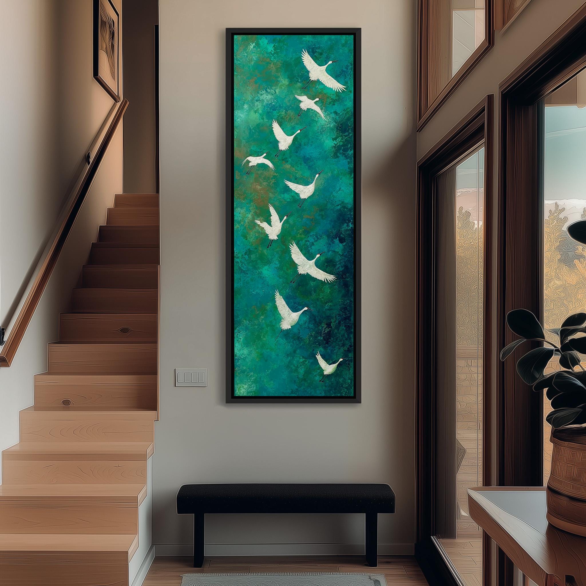 a large painting of white birds against a green background, hanging on a wall in a hallway.