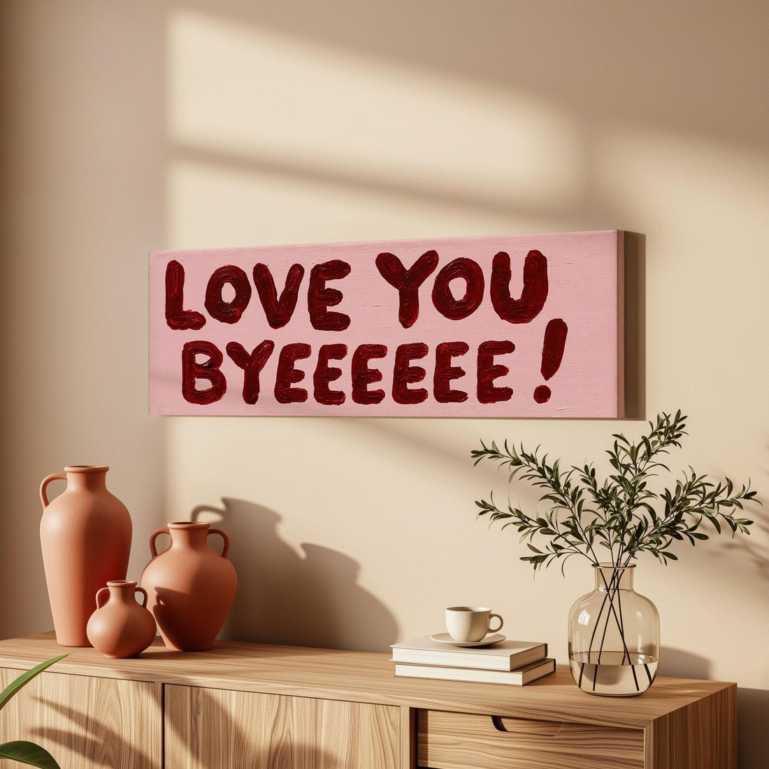 Love you byeeeee retro quote long horizontal canvas print above a sofa in a living room
